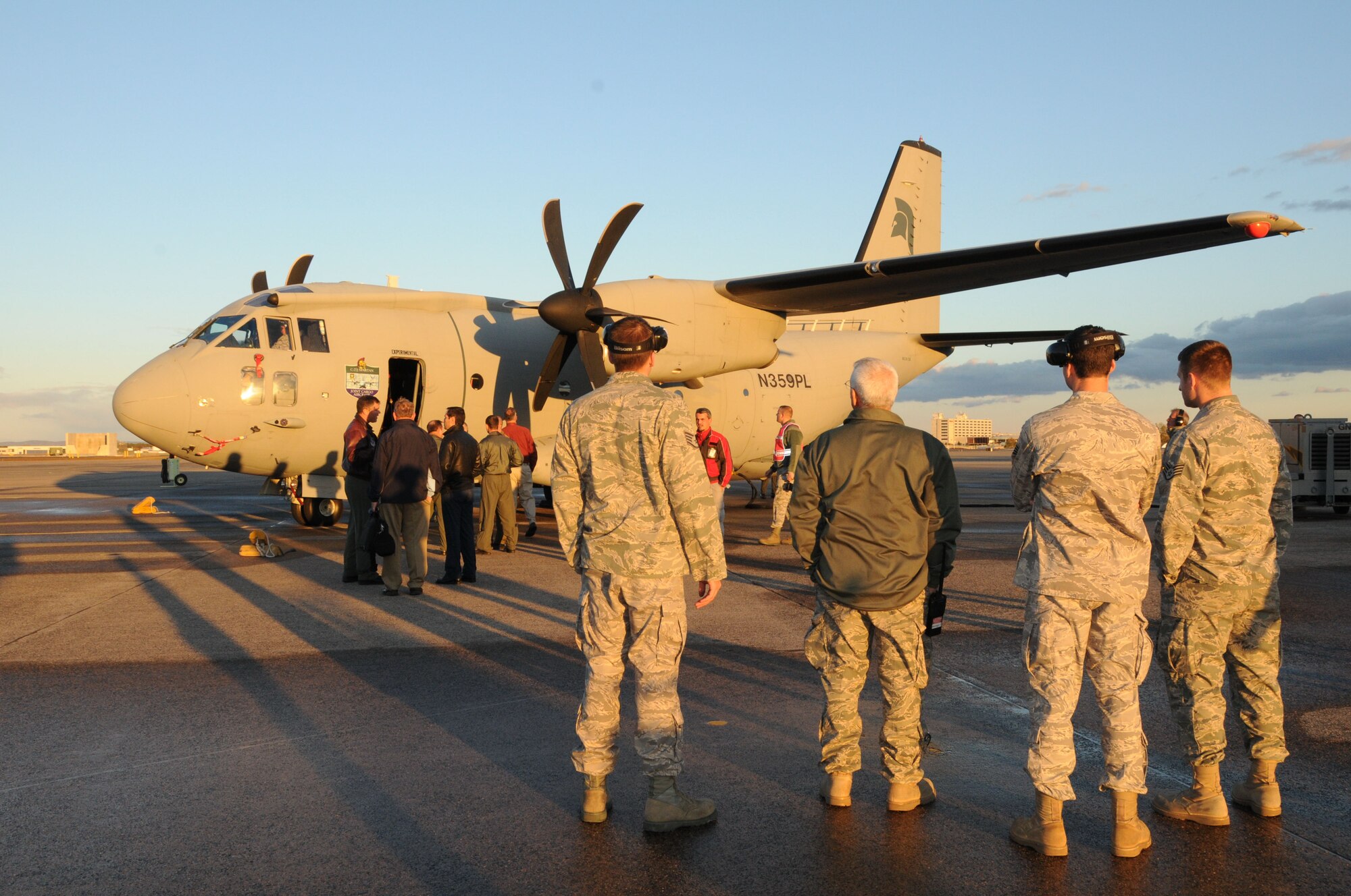 Members of the 103rd Airlift Wing observe the new C27J Spartan upon its arrival to the Bradley Air National Guard Base in East Granby, Conn. on Thursday, Oct. 21, 2010.  The aircraft visit afforded the Flying Yankees of the 103rd Airlift Wing an opportunity to experience its future mission capabilities first hand.  (U.S. Air Force photo by Tech. Sgt. Erin E. McNamara)