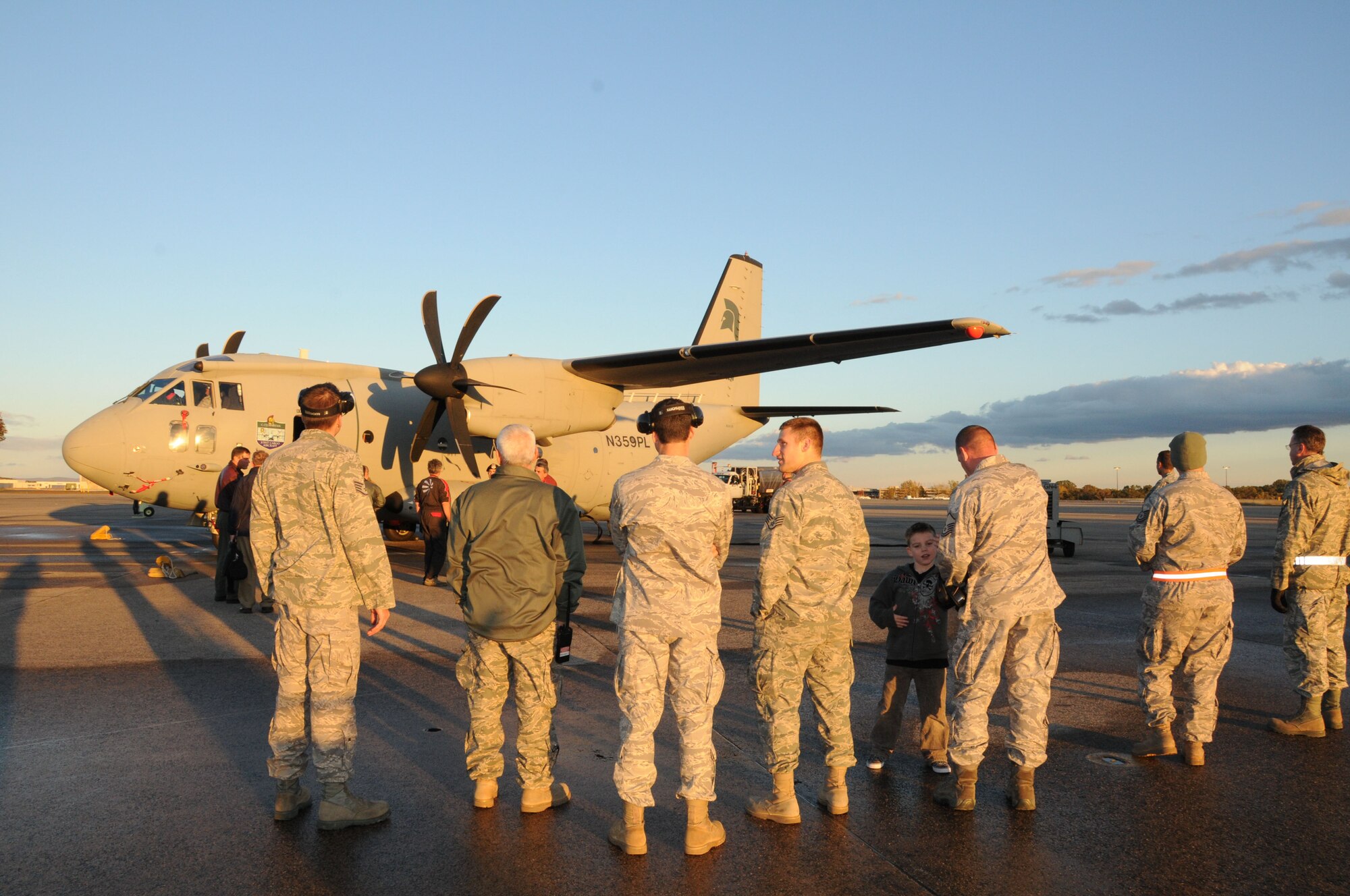 Members of the 103rd Airlift Wing observe the new C27J Spartan upon its arrival to the Bradley Air National Guard Base in East Granby, Conn. on Thursday, Oct. 21, 2010.  The aircraft visit afforded the Flying Yankees of the 103rd Airlift Wing an opportunity to experience its future mission capabilities first hand.  (U.S. Air Force photo by Tech. Sgt. Erin E. McNamara)
