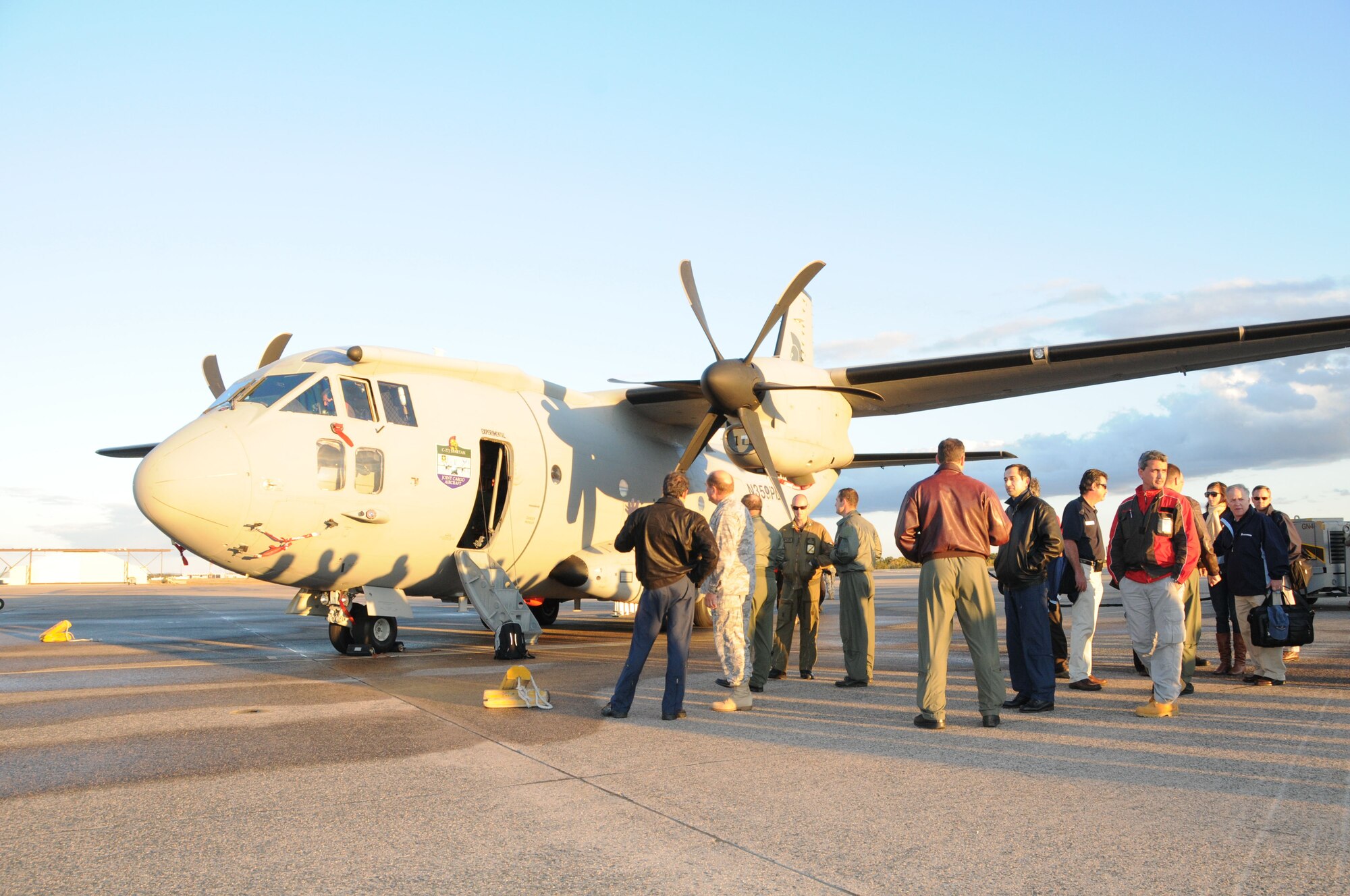 Members of the 103rd Airlift Wing observe the new C27J Spartan upon its arrival to the Bradley Air National Guard Base in East Granby, Conn. on Thursday, Oct. 21, 2010.  The aircraft visit afforded the Flying Yankees of the 103rd Airlift Wing an opportunity to experience its future mission capabilities first hand.  (U.S. Air Force photo by Tech. Sgt. Erin E. McNamara)
