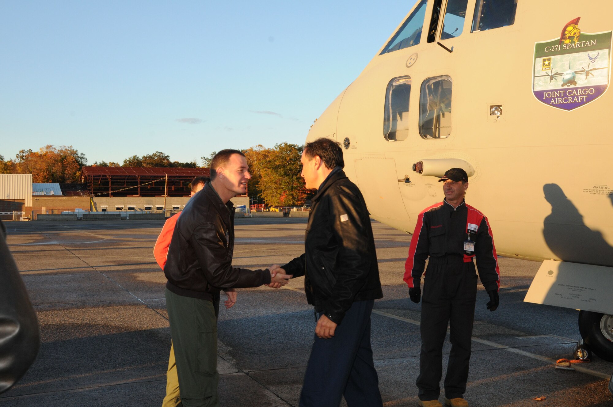 Colonel Frank Detorie (left), Commander, 103rd Airlift Wing, greets representatives of Alenia Aeronautica as they arrive in a C27J Spartan to Bradley Air National Guard Base in East Granby, Conn. on Thursday, Oct. 21, 2010.  The visit by the Italian manufacturer, which featured a familiarization tour of the aircraft, afforded the Flying Yankees of the 103rd Airlift Wing an opportunity to experience its future mission capabilities first hand.  (U.S. Air Force photo by Tech. Sgt. Erin E. McNamara)
