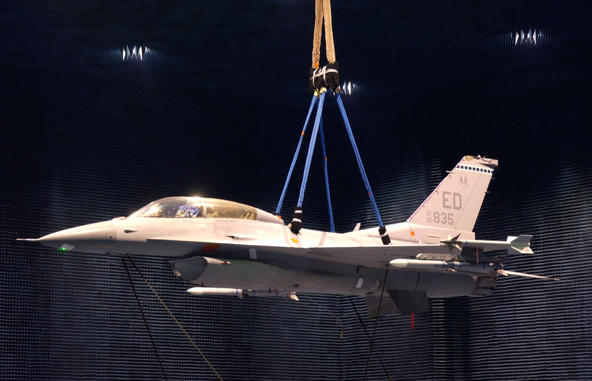 An Edwards F-16 hangs in the Benefield Anechoic Facility to undergo testing. The BAF is the largest anechoic facility in the world. (Air Force photo)