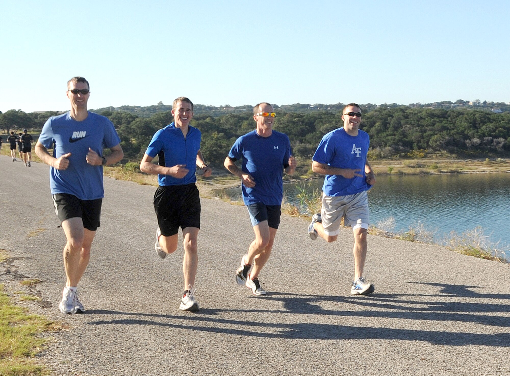 From left, 1st Lt. Wade Brett, 2nd Lt. Andrew Morris, Capt. Matt Gjertsen and team leader Capt. Jason Jones, are members of the 32nd Flying Training Squadron entry in the Randolph Rambler 120 triathlon Oct. 16. The team took first place in the all-male relay division. (Courtesy photo)