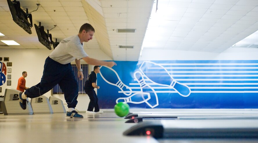 Maj. Jason Wrachford, 436th Airlift Wing Base Legal Office, aims for a strike during Fall Wing Sports Day at the Eagle Lanes Bowling Center, Dover Air Force Base, Del., Oct. 22, 2010Fall Wing Sports Day started with a Warrior Run, and featured many different kinds of sports. (U.S. Air Force photo by Roland Balik/Released)