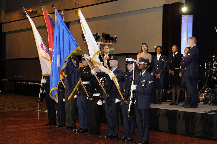 CHARLESTON, SC (October 23, 2010) The Joint Base Charleston Honor Guard and Naval Consolidated Brig Joint Service Honor Guard present the colors as the 2010 Joint Base Charleston Military Ball Choir sings the national anthem at the first JB CHS Military Ball held at the North Charleston Convention Center, Oct. 23, 2010. (U.S. Navy photo/Mass Communication Specialist 1st Class Jennifer R. Hudson)