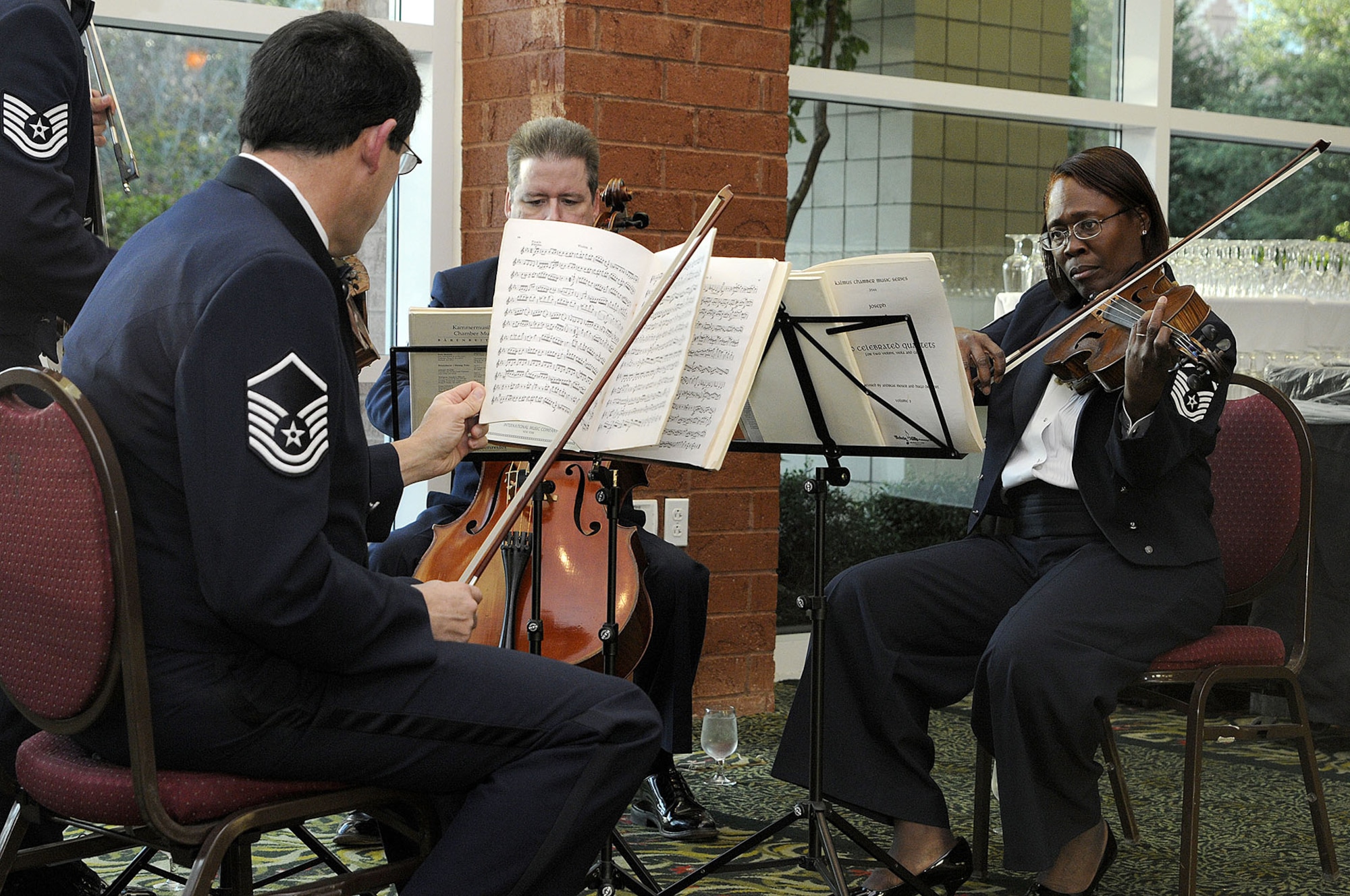 CHARLESTON, SC (October 23, 2010) Members of the United States Air Force Band, Strings Quartet, warm-up prior to their performance at the first Joint Base Charleston Military Ball held at the North CHS Convention Center, Oct. 23, 2010. The band traveled from Washington, D.C. to play during dinner. (U.S. Navy photo/Mass Communication Specialist 1st Class Jennifer R. Hudson)