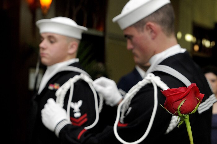 CHARLESTON, SC (October 23, 2010) Members of the Joint Honor Guard, Master-at-Arms 2nd Class Chase Ferguson, right, and Mineman 2nd Class Kaleb Dubose fine tune each other?s uniform prior to the first Joint Base Charleston Military Ball held Oct. 23, 2010 at the North CHS Convention Center. MA2 Ferguson is a reserve member attached to Naval Security Forces, Joint Base Charleston-Weapons Station and MN2 Dubose is attached to Naval Munitions Command aboard JB CHS-WS. (U.S. Navy photo/Mass Communication Specialist 1st Class Jennifer R. Hudson)