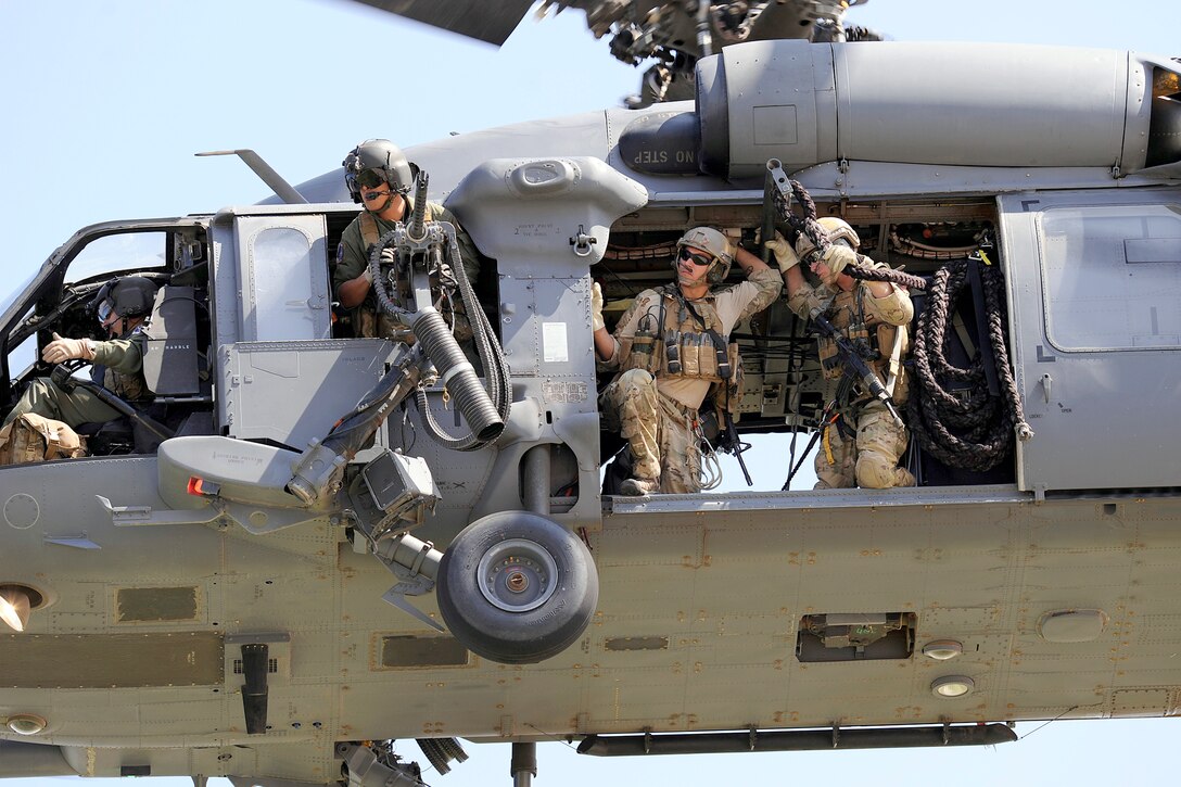 An HH-60 Pave Hawk helicopter crew participates in a combat search and rescue demonstration Oct. 1, 2010, at the U.S. Air Force Academy in Colorado Springs, Colo.  The HH-60 and its crew are assigned to Davis Monthan Air Force Base, Ariz.  (U.S. Air Force photo/Mike Kaplan)