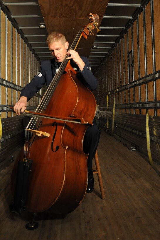 COLUMBUS, N.J.-- Tech. Sgt. Matthew Murray, U.S. Air Force Band Member, double Bass player,  practices before a performance Oct. 14 at Northern Burlington County Middle School, Columbus, N.J.  The performance is the ninth of the band’s three-week 2010 Fall Tour. (U.S. Air Force photo by Senior Airman Christopher Ruano)
