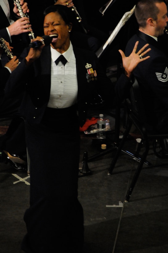 OYSTER BAY, N.Y.-- Master Sgt. Shani Prewitt, vocalist from Max Impact, captures the crowd while singing “Freedom” during the Oyster Bay High School performance on the 2010 Fall Tour. The performance is the second of the band’s three-week 2010 Fall Tour. (U.S. Air Force Photo by Air Force Airman 1st Class Tabitha N. Haynes)