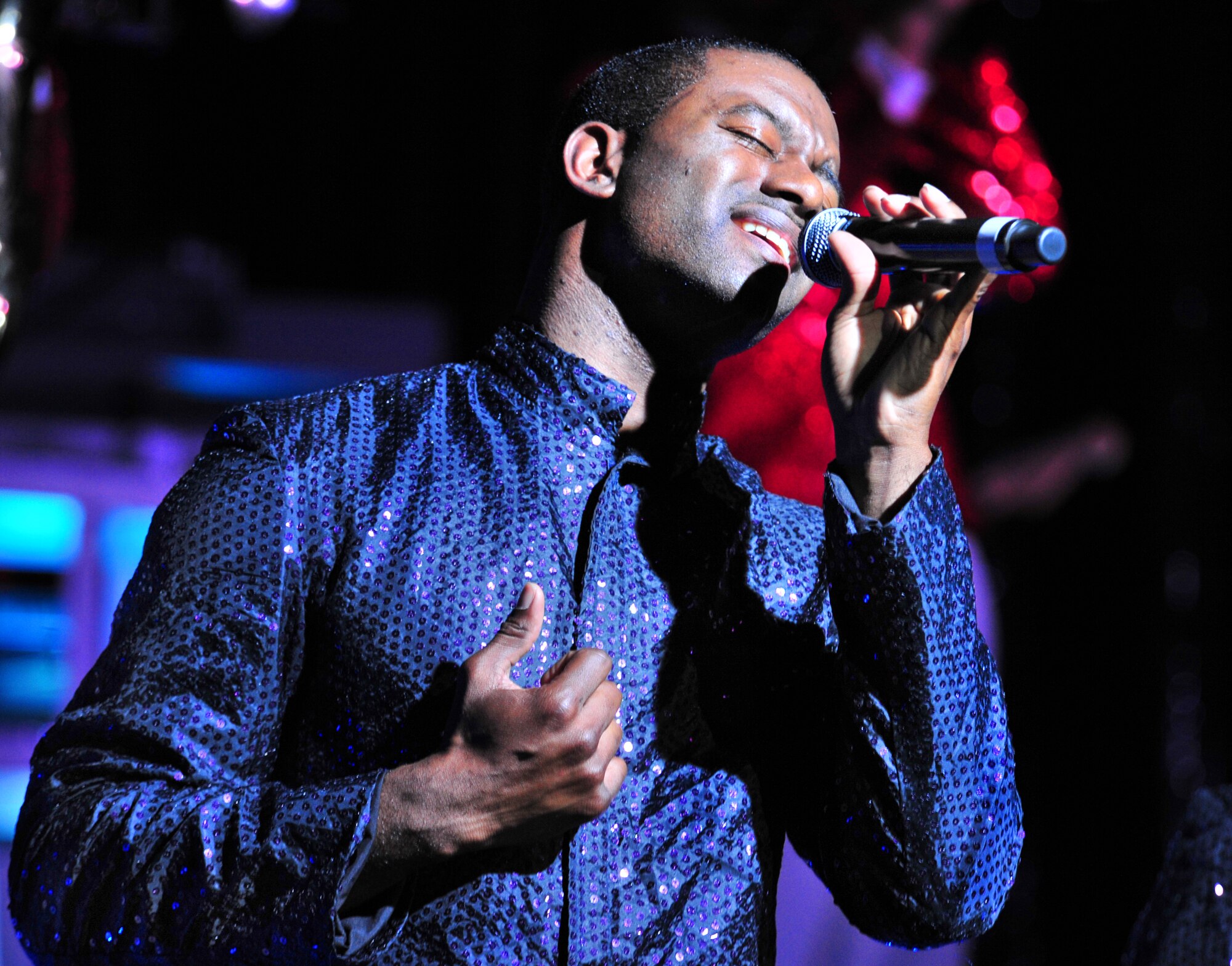 101023-F-8430J-248
SHAW AIR FORCE BASE, S.C. - Staff Sgt. Antonio Howard, Tops in Blue performer, sings Oct. 23, 2010. Tops in Blue entertains Airmen and their families, coalition partners and audiences around the world with musical theatrics. Their tour includes more than 80 shows worldwide, many for deployed service members in the Southwest Asia area of operations. (U.S. Air Force photo/Airman 1st Class Amber E. N. Jacobs (Released))