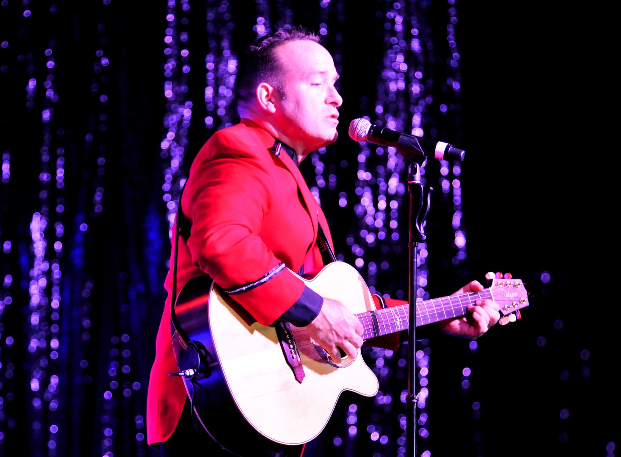 101023-F-8430J-114
SHAW AIR FORCE BASE, S.C. - Master Sgt. Robert Clark, Tops in Blue performer, sings and plays guitar during a performance Oct. 23, 2010. Tops in Blue entertains Airmen and their families, coalition partners and audiences around the world with musical theatrics. Their tour includes more than 80 shows worldwide, many for deployed service members in the Southwest Asia area of operations. (U.S. Air Force photo/Airman 1st Class Amber E. N. Jacobs (Released))
