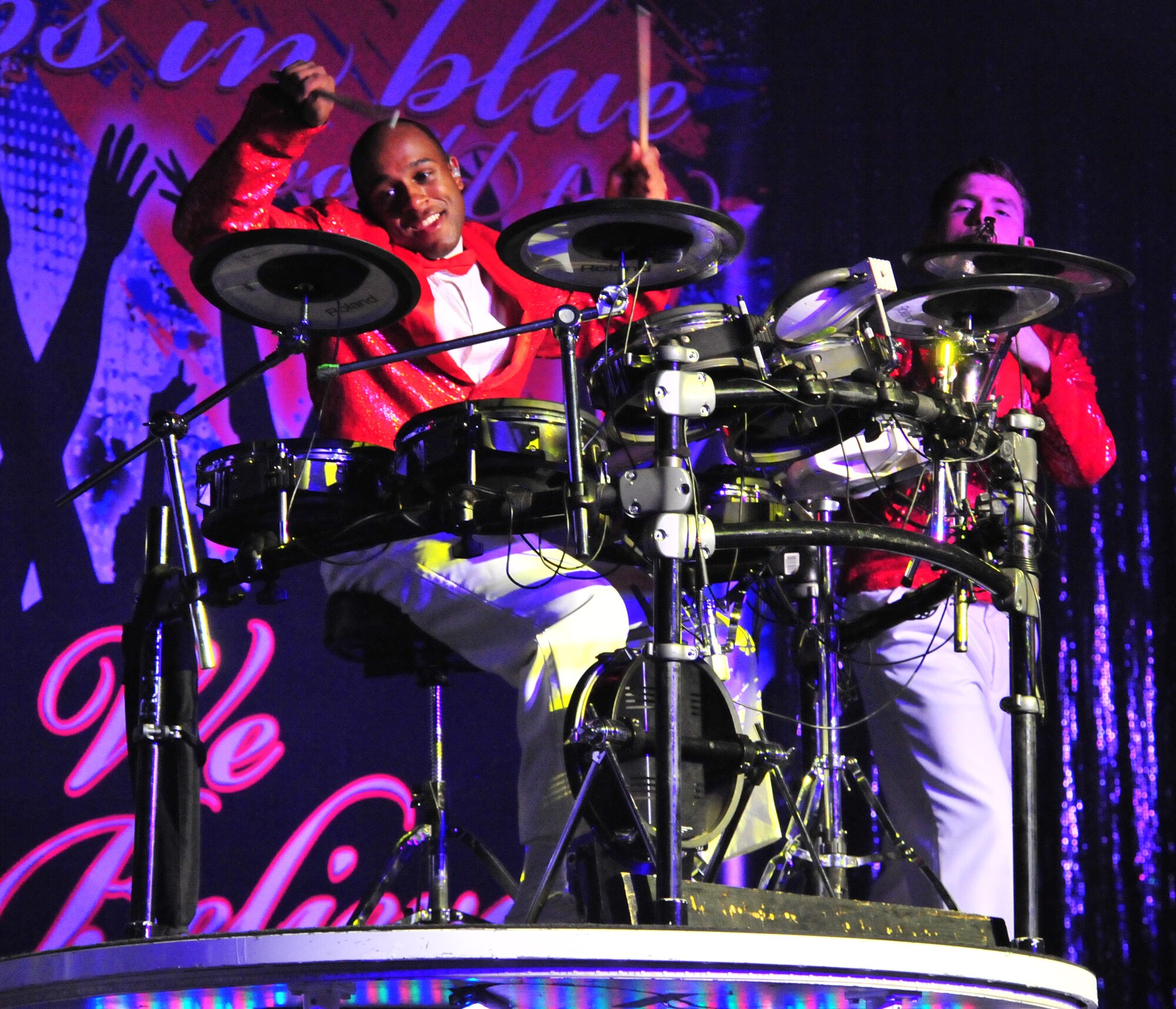 101023-F-8430J-069
SHAW AIR FORCE BASE, S.C. - Senior Airman Breyson Robinson (left) and Staff Sgt. Steven Brumley (right), Tops in Blue performers, play their instruments during the opening song Oct. 23, 2010. Tops in Blue entertains Airmen and their families, coalition partners and audiences around the world with musical theatrics. Their tour includes more than 80 shows worldwide, many for deployed service members in the Southwest Asia area of operations. (U.S. Air Force photo/Airman 1st Class Amber E. N. Jacobs (Released))
