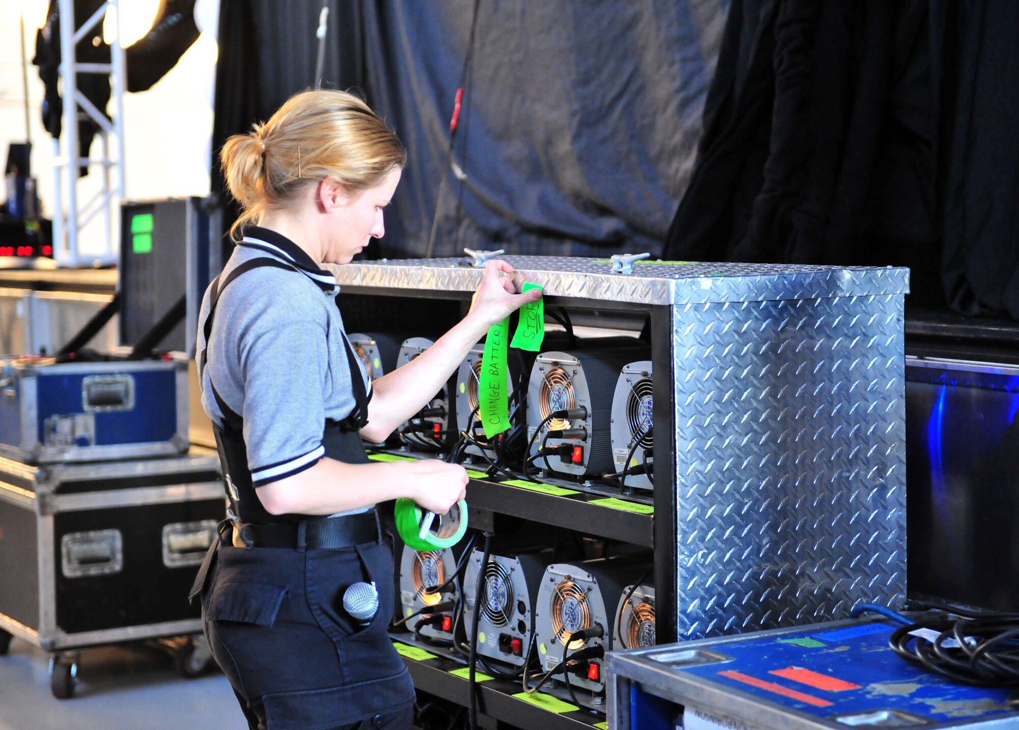101023-F-8430J-004
SHAW AIR FORCE BASE, S.C. - Technical Sgt. Katie Badowski, Tops in Blue performer, reviews and updates equipment behind the set before the start of their performance Oct. 23, 2010. Tops in Blue entertains Airmen and their families, coalition partners and audiences around the world with musical theatrics. Their tour includes more than 80 shows worldwide, many for deployed service members in the Southwest Asia area of operations. (U.S. Air Force photo/Airman 1st Class Amber E. N. Jacobs (Released))
