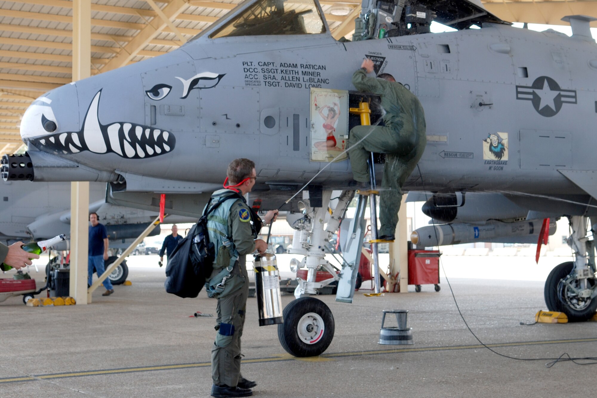 Capt. Adam Ratican, a 47th Fighter Squadron instructor pilot, gets a wet down from Capt. Jason Cobb, 47th FS instructor pilot, after returning from his final flight with the squadron on Oct. 19, 2010, at Barksdale Air Force Base, La. (U. S. Air Force Photo/Master Sgt. Greg Steele)