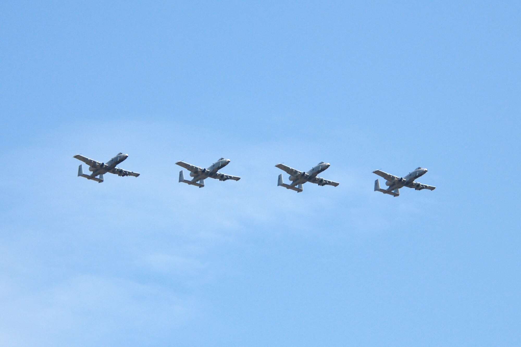 A 4-ship of 47th Fighter Squadron A-10 Thunderbolt II aircraft led by Capt. Adam Ratican, a 47FS instructor pilot, flies overhead during his final flight with the “Terrible Termites” on Oct. 19, 2010, at Barksdale Air Force Base, La. (U. S. Air Force Photo/Master Sgt. Greg Steele)

