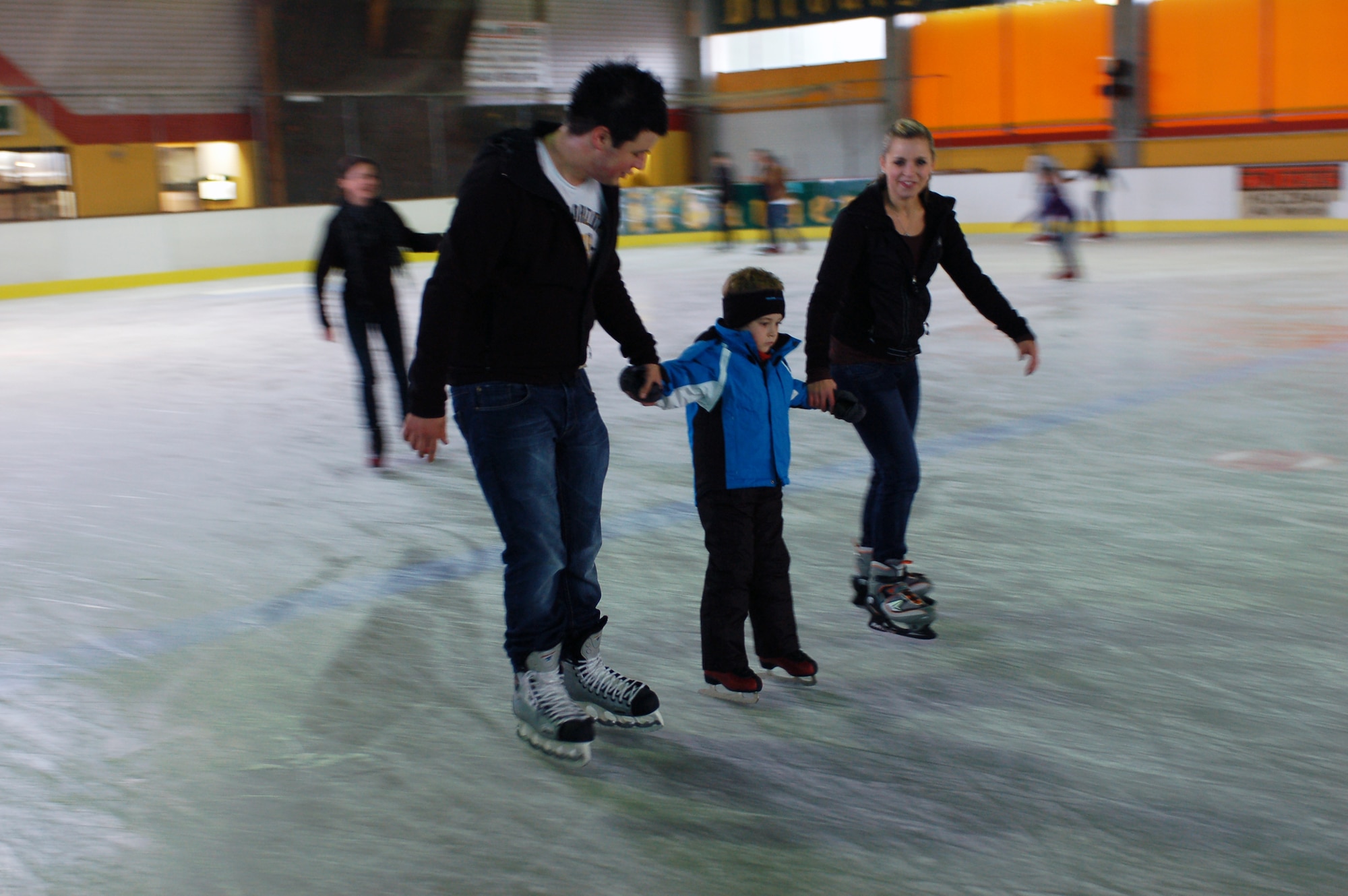 BITBURG, Germany -- A local family ice skates Sunday, which is Family Day, when families are eligible to receive price reductions 10 a.m. - 1 p.m. at the Bitburg ice rink. The family price is four Euros per adult and one Euro per child. Skate rental is three Euros per adult and one Euro per child for the first three children, and it is two Euros per child for any additional child. Two ice rinks can be found in the Eifel area, one of which is in Trier, and one (as shown in the photo) is located right outside the former base in Bitburg.  The Bitburg ice rink is now open for the 2010 season and will remain open until April 2011. (U.S. Air Force photo/Iris Reiff)