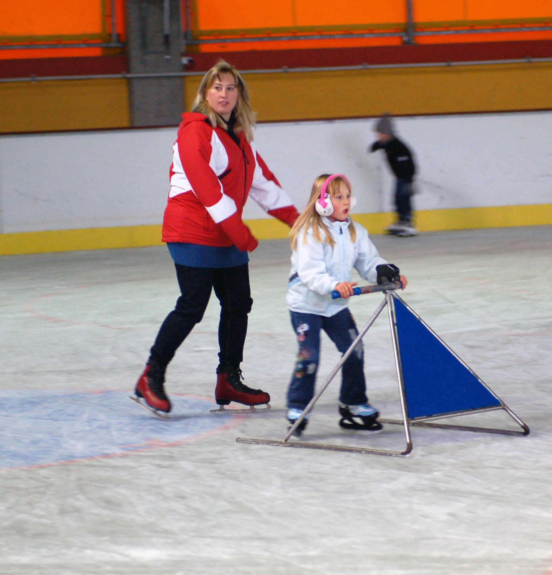 BITBURG, Germany -- A child at the Bitburg ice rink uses special learning equipment designed to help children keep their balance as they learn how to ice skate. Ice stadium officials will provide respective information and help with training children or adults on the ice. Two ice rinks can be found in the Eifel area, one of which is in Trier, and one (shown in the photo) is located right outside the former base in Bitburg.  The Bitburg ice rink is now open for the 2010 season and will remain open until April 2011. (U.S. Air Force photo/Iris Reiff)