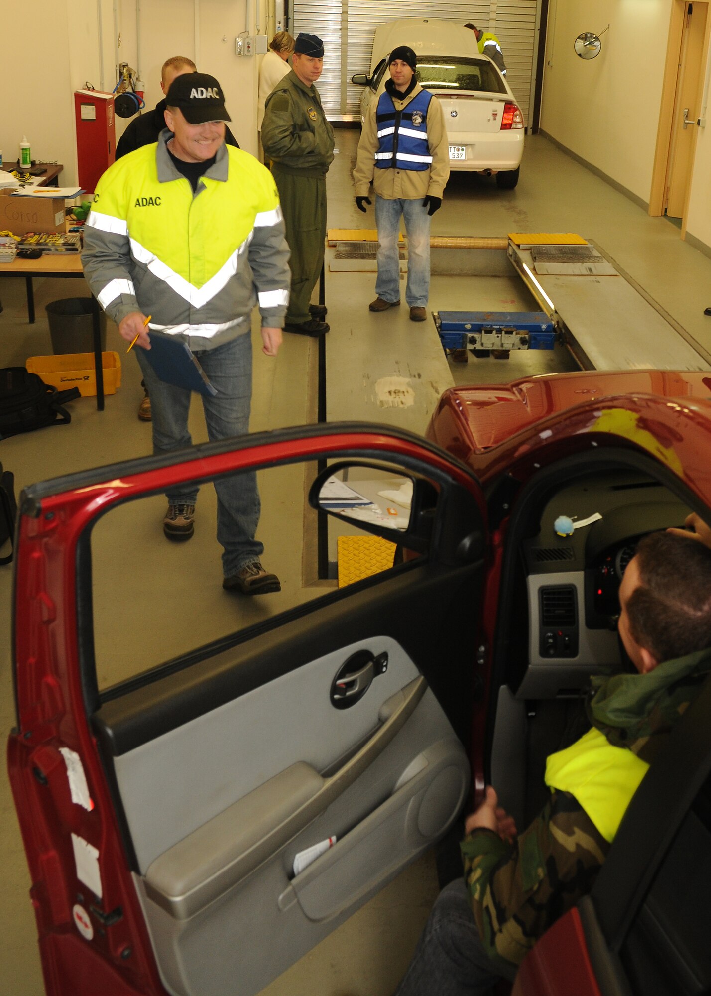 SPANGDAHLEM AIR BASE, Germany – Members of the 52nd Fighter Wing Safety Office and ADAC, a German Auto club similar to the American Auto Association, perform free vehicle inspections for the upcomeing winter Oct. 23. The inspections identify potential hazards on personally owned vehicles before winter driving conditions arrive. (U.S. Air Force photo/Staff Sgt. Benjamin Wilson)