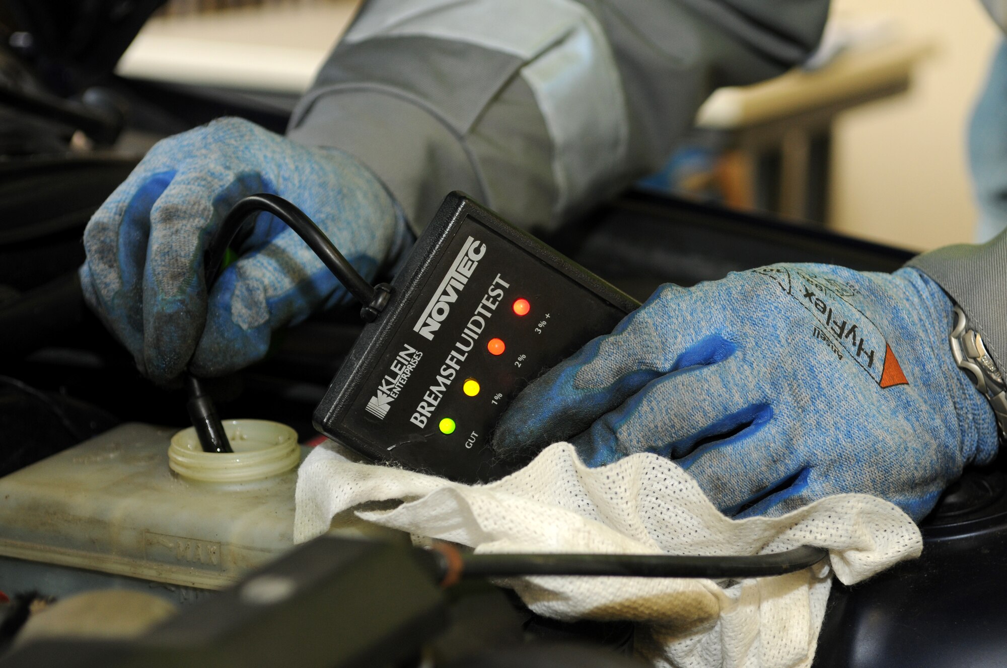 SPANGDAHLEM AIR BASE, Germany – Wolfgang Gaida, ADAC representative, test brake fluid of a base member’s vehicle during a winter check Oct. 23. ADAC, a German auto club similar to the American Automobile Association, visited the base and partnered with the 52nd Fighter Wing Safety Office to perform free inspections on privately owned vehicles to identify potential hazards before winter driving conditions arrive. (U.S. Air Force photo/Staff Sgt. Benjamin Wilson)