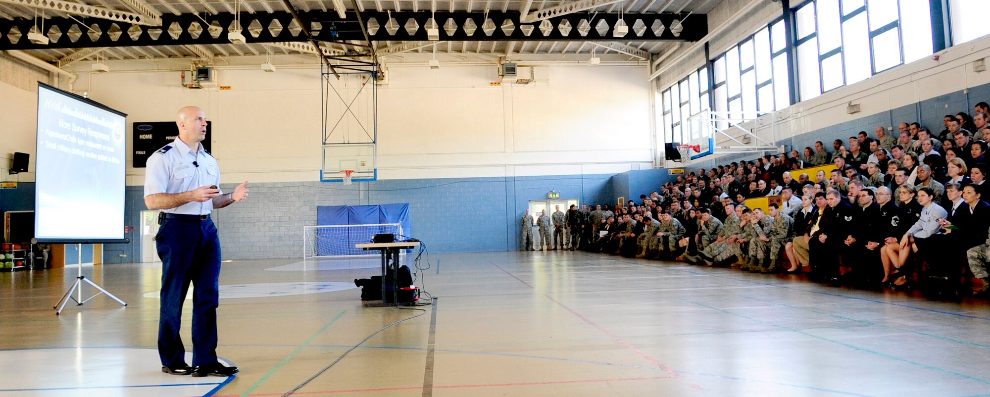 RAF MILDENHALL, England -- Col. Chad Manske, 100th Air Refueling Wing commander, speaks to the Airmen of RAF Mildenhall during one of his four commander's calls Oct. 25. Colonel Manske held the calls to inform the base of the wing mission, vision, priorities and to talk about the top survey concerns and the actions that are being taken to address them. (U.S. Air Force photo/Senior Airman Ethan Morgan)