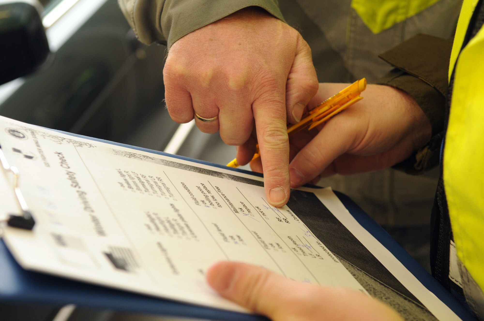SPANGDAHLEM AIR BASE, Germany – Representatives from ADAC, a German auto club similar to the American Automobile Association, review a checklist of winter safety standards Oct. 23. The club partnered with the 52nd Fighter Wing Safety Office to perform free winter safety checks for privately owned vehicles on base. (U.S. Air Force photo/Staff Sgt. Benjamin Wilson)