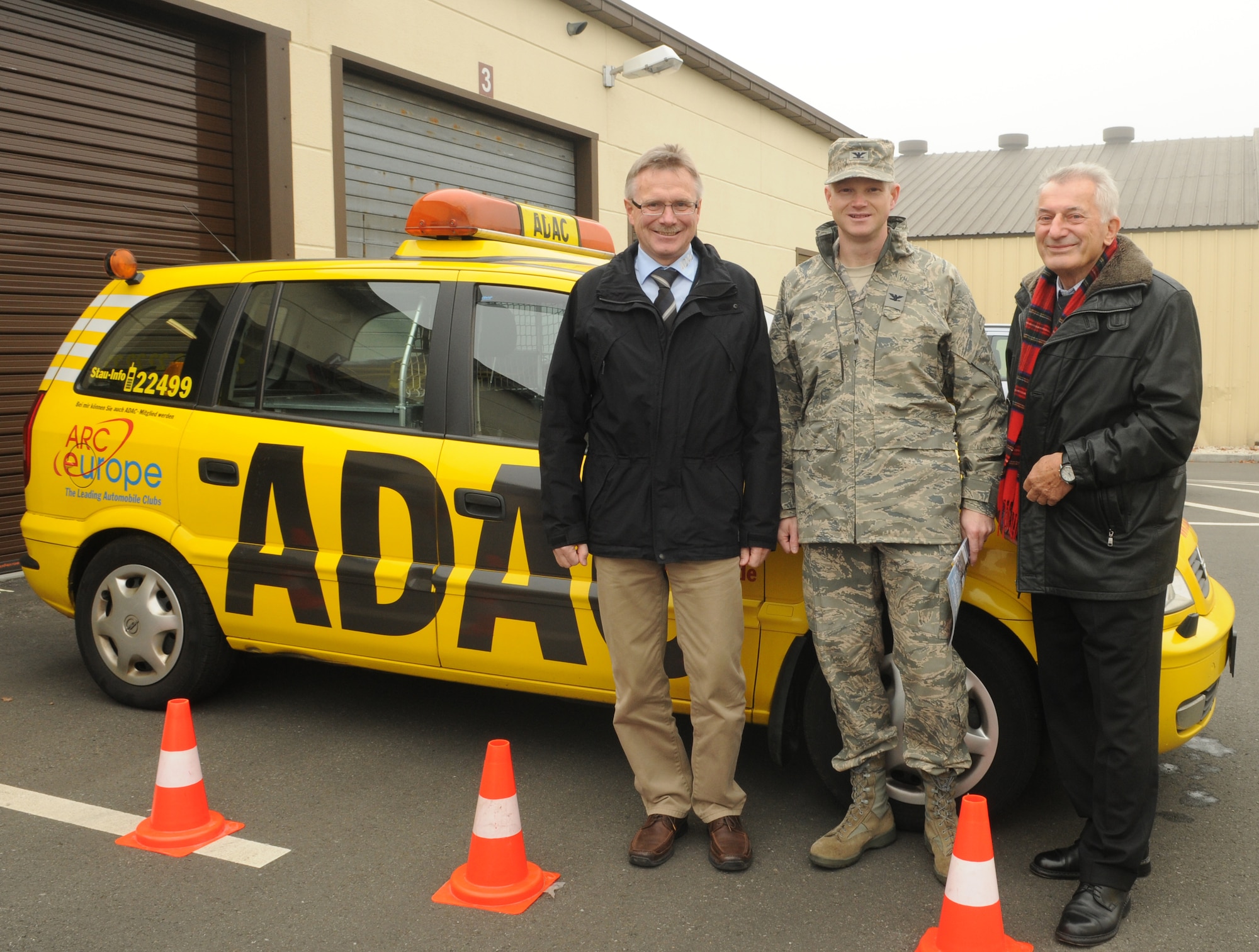 SPANGDAHLEM AIR BASE, Germany – From left, Dr. Klaus Manns, ADAC regional board member; Col. Christopher Weggeman, 52nd Fighter Wing commander; and Ekkehart Roehr, ADAC regional board member, pose for a photo in front of an ADAC car Oct. 23. ADAC, a German auto club similar to the American Automobile Association, visited the base and partnered with the 52nd FW Safety Office to perform free inspections on privately owned vehicles to identify potential hazards before winter driving conditions arrive. (U.S. Air Force photo/Staff Sgt. Benjamin Wilson)