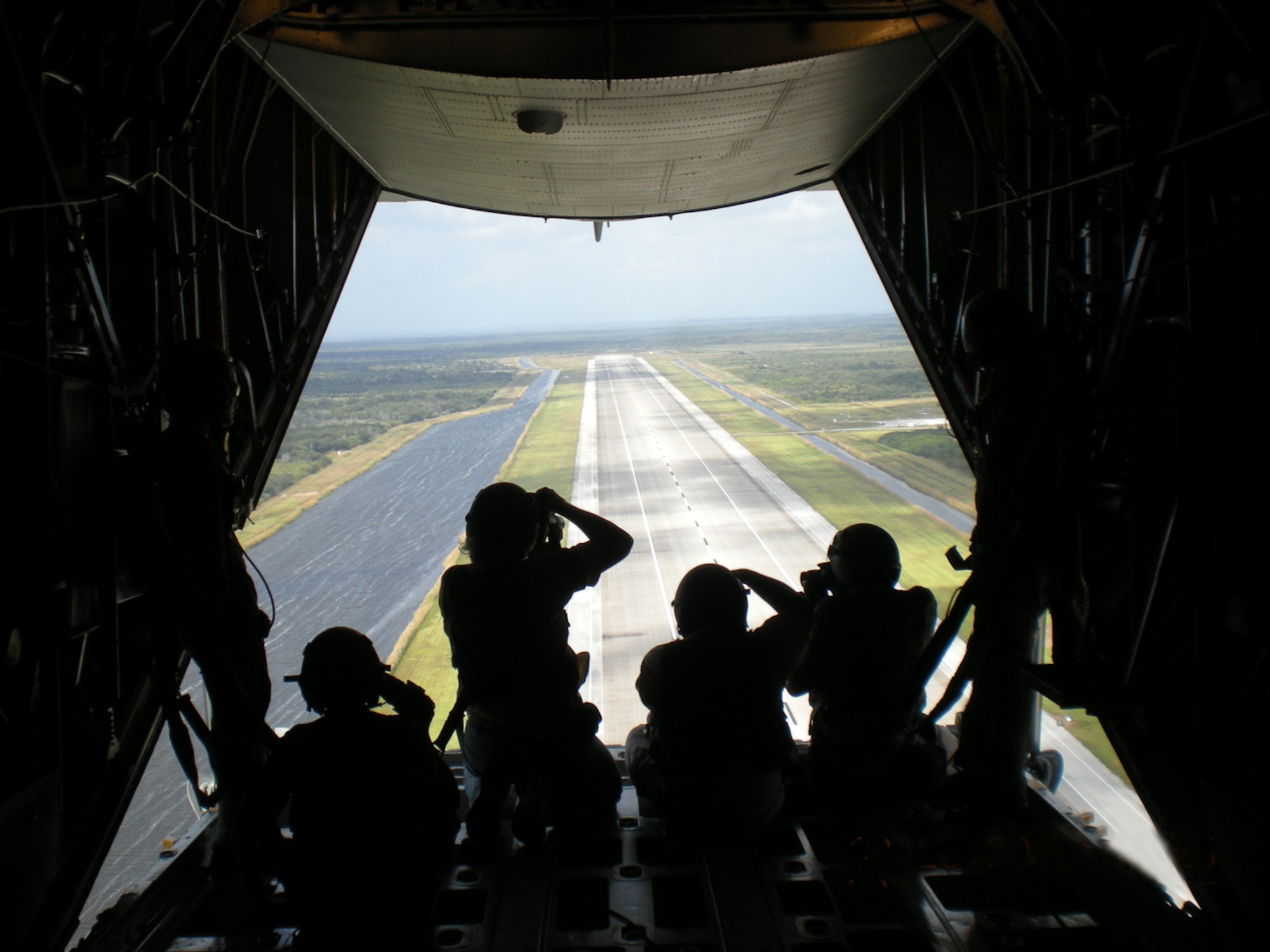 CAPE CANAVERAL AIR FORCE STATION, Fla. - Twenty five members of the media from central Florida and Georgia attended media day, Oct. 25, 2010, to help gain momentum for Central Florida's Air Force Week, which runs through Halloween, celebrating America's Airmen. The Air Force Reserve's 920th Rescue Wing from Patrick Air Force Base, flew the media around CCAFS and its neighbor, Kennedy Space Center in two HH-60G Pave Hawks and an HC-130 King. Space shuttle Discovery was part of the sites as it prepares for lift off Nov. 1. The Rescue Wing Airmen had the chance to showcase thier role as guardians of the astronauts during lift offs. (U.S. Air Force photo/Staff Sgt. Michele Gibson)          