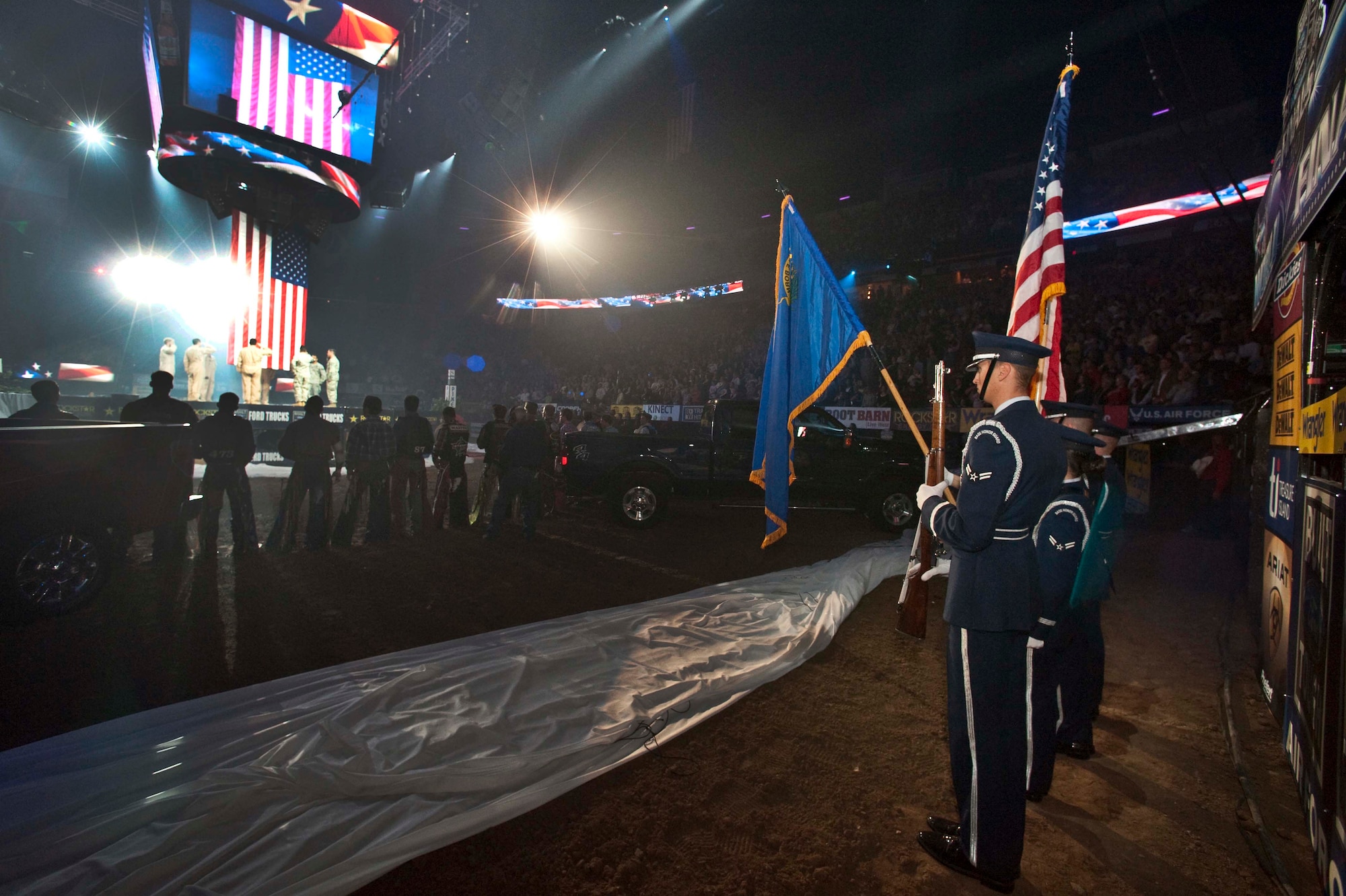 The Nellis Air Force Base Honor Guard presents the colors during the national anthem at the Professional Bull Riders World Finals at the Thomas & Mack Center in Las Vegas Oct. 22. Nellis Airmen were honored for their service during Air Force night at the event.  (U.S. Air Force photo/Tech. Sgt. Michael R. Holzworth)