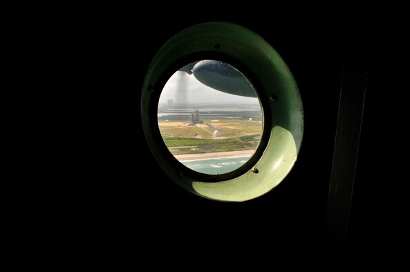 CAPE CANAVERAL AIR FORCE STATION, Fla. - Rescue Reservists from the Air Force Reserve's 920th Rescue Wing here hosted media personel aboard an HC-130P/N King aircraft. The media were invited for a look behind and beyond the gates of the central Florida Air Force bases, here and Patrick, which is approximately 11 miles south. Media were treated to a tour of the rocket launch pads which are manned by the host base, the 45th Space Wing, and to the NASA Space Shuttle Discovery. The event was held prior to Cocoa Beach Air Force Week to raise awareness for the Air Force in the region and salute Hometown Heroes serving in the Air Force. Appoximately 25 media personnel were present to document the day which was capped off by this flight in the King around Space Shuttle Discovery. (U.S. Air Force Photo/Capt. Cathleen Snow)