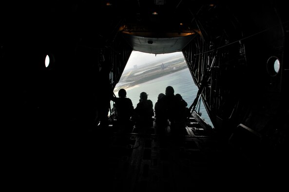 CAPE CANAVERAL AIR FORCE STATION, Fla. - Rescue Reservists from the Air Force Reserve's 920th Rescue Wing at Patrick Air Force Base, hosted media personell aboard an HC-130P/N King aircraft. The media were invited for a look behind and beyond the gates of the central Florida bases, here and Patrick, which is approximately 11 miles south. Media were treated to a tours of the rocket launch pads which are manned by the host base, the 45th Space Wing, and to the NASA Space Shuttle Discovery. The event was held prior to Cocoa Beach Air Force Week to raise awareness for the Air Force in the region and salute Hometown Heroes serving in the Air Force. Appoximately 25 media personnel were present to document the day which was capped off by this flight in the King around Space Shuttle Discovery. (U.S. Air Force Photo/Capt. Cathleen Snow)