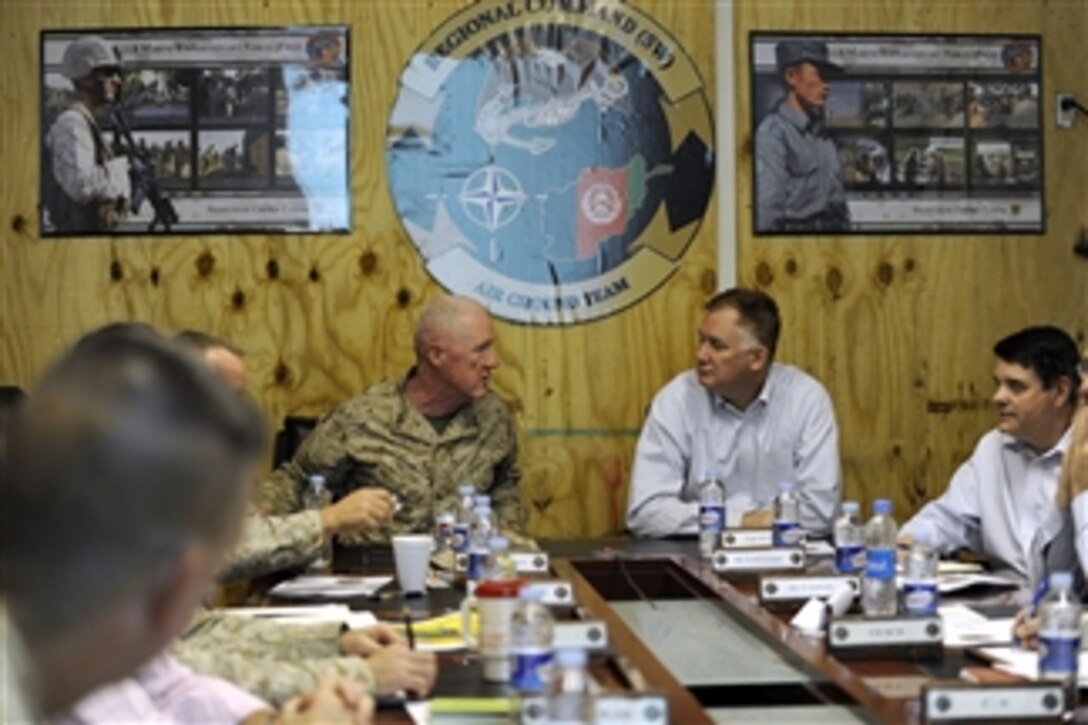 Deputy Secretary of Defense William J. Lynn III meets with Commander of Regional Command-Southwest Maj. Gen. Mills in Afghanistan on Oct. 27, 2010.  