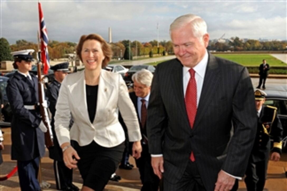 Secretary of Defense Robert M. Gates escorts Norwegian Defense Minister Grete Faremo through an honor cordon and into the Pentagon on Oct. 27, 2010.  Gates and Faremo will conduct bilateral security discussions on a wide range of issues.  