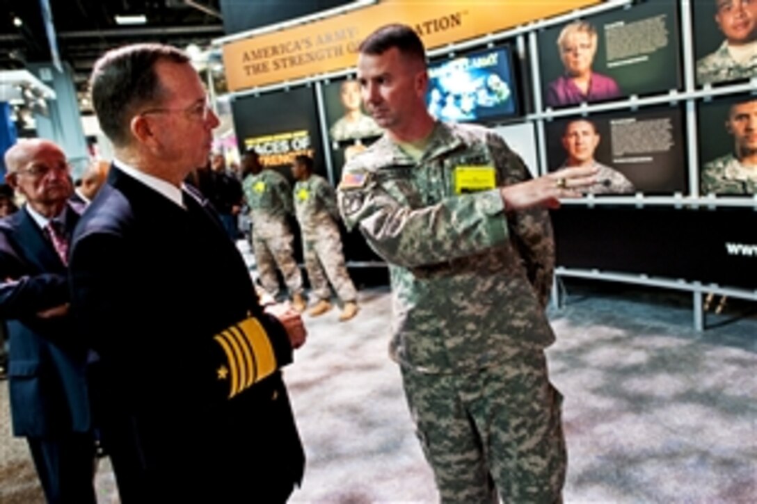 Navy Adm. Mike Mullen, chairman of the Joint Chiefs of Staff, speaks with Army Sgt. 1st Class George J. Kirkpatrick at the 60th Annual Association of the U.S. Army Meeting and Exposition in Washington, D.C., Oct. 27, 2010.






