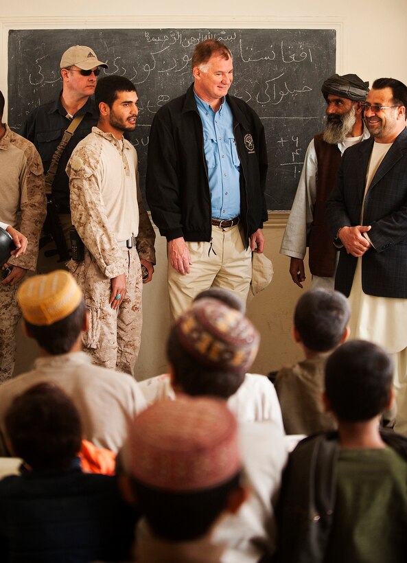 William J. Lynn III, the deputy secretary of defense, visits a classroom at Khalaj High School during a tour of Nawa, Afghanistan, Oct. 28, 2010. Lynn visited Forward Operating Base Jaker and toured the surrounding area in Nawa to note progress by the Nawa Government and coalition forces.