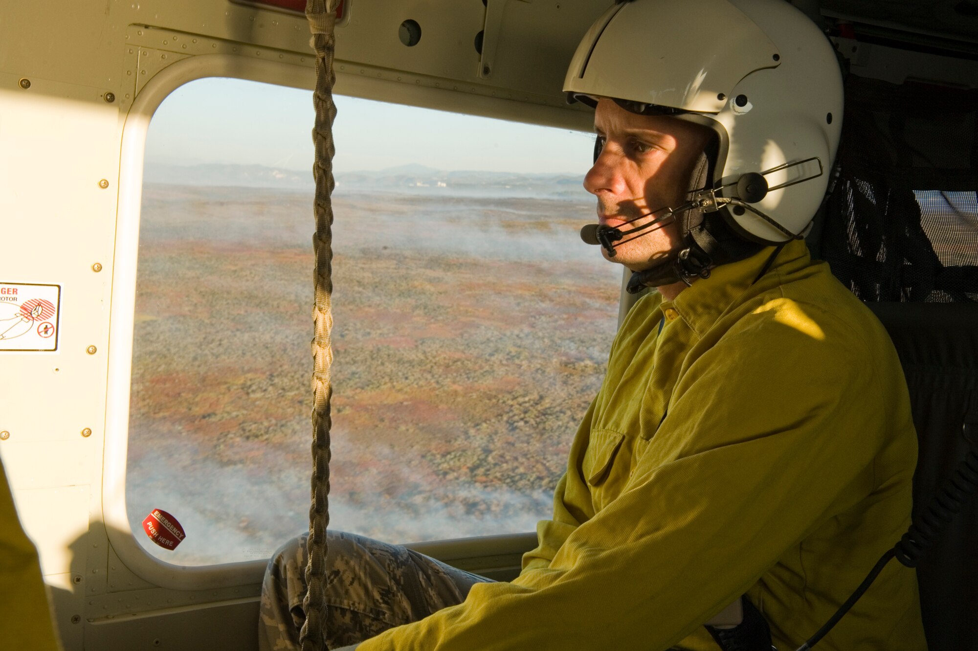VANDENBERG AIR FORCE BASE, Calif. – Col. Richard Boltz, 30th Space Wing commander, looks down upon more than 400 acres of base property that has burned here in the Bear Creek Fire on Thursday, Oct. 28, 2010. Approximately 150 firefighters and emergency responders are working to contain the blaze, which is slowing down in growth due to dying winds. (U.S. Air Force photo/Staff Sgt. Levi Riendeau)