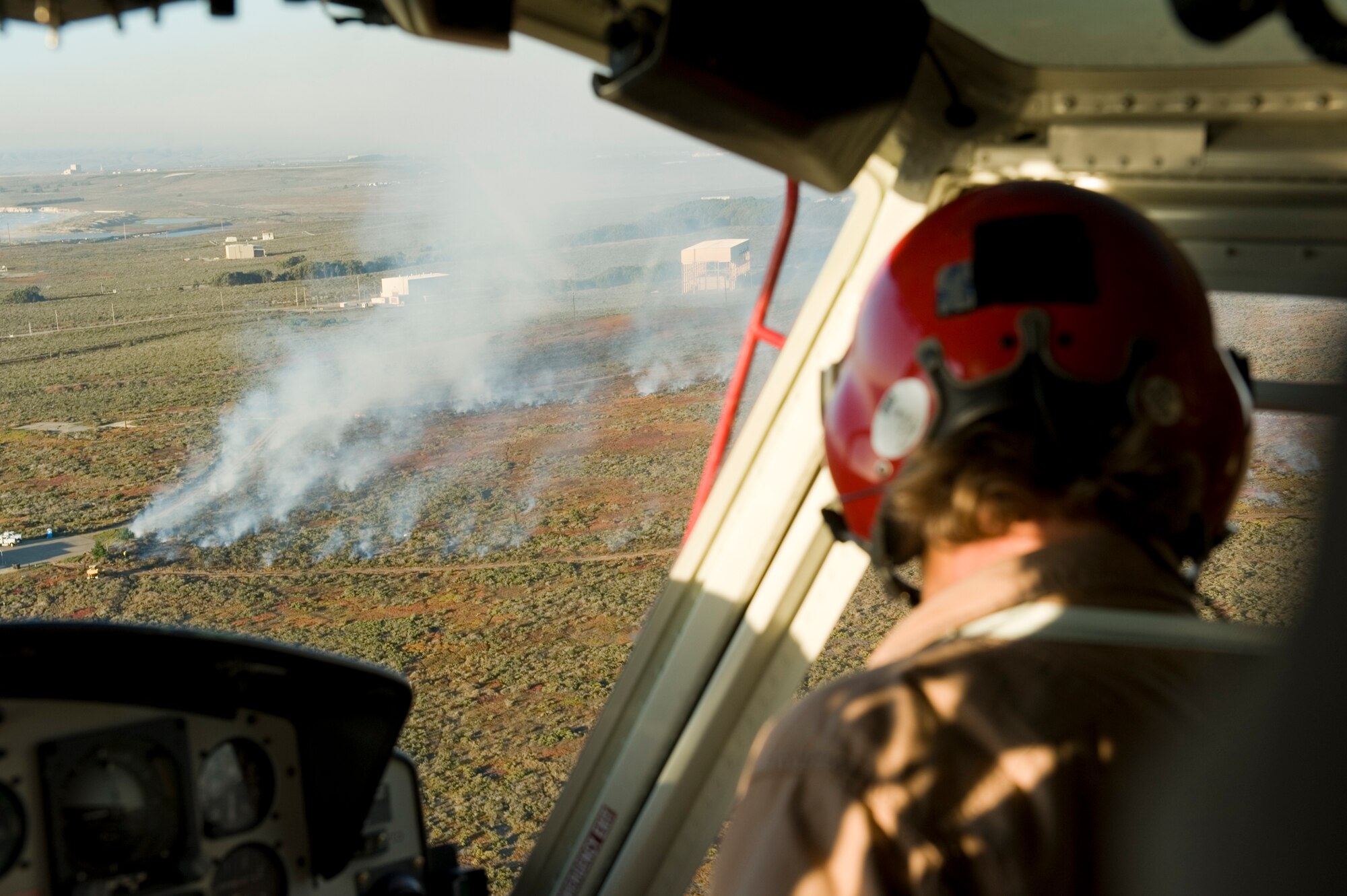 VANDENBERG AIR FORCE BASE, Calif. – More than 400 acres of base property burns while fire crews attempt to put it out here Thursday, Oct. 28, 2010. Firefighters are working to control where the fire burns, as the area involved is known to contain unexploded ordnance. (U.S. Air Force photo/Staff Sgt. Levi Riendeau)