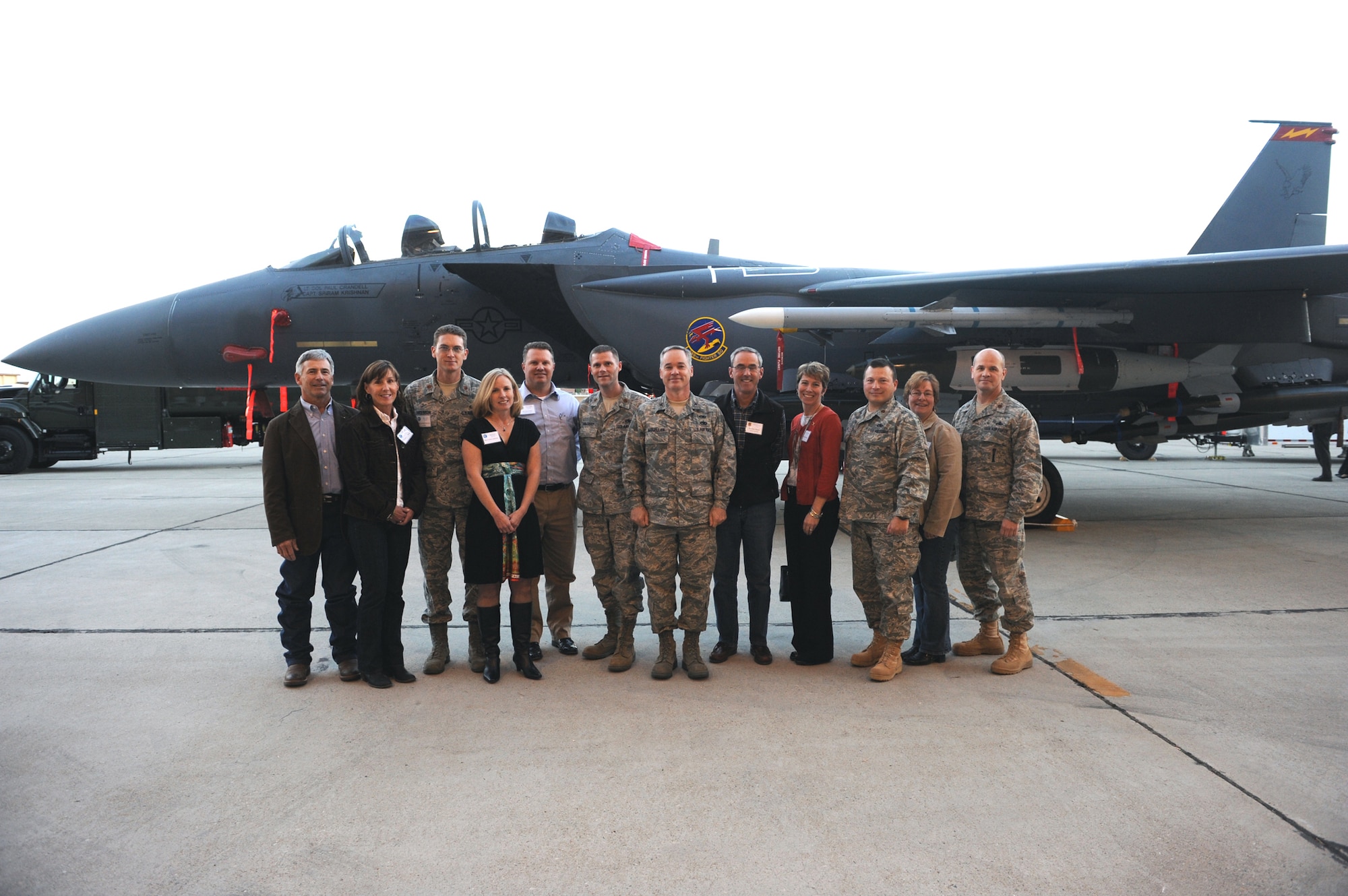 MOUNTAIN HOME AIR FORCE BASE, Idaho --  Col. James McClellan, 366th Maintenance Group commander, (center) poses for a picture with the Maintenance Group and honorary commanders after the Honorary Commander Change of Command Ceremony Oct. 22 in hangar 1331. During the two-year term, Honorary Commanders participate in creative and unique events to learn the specifics of the wing mission. Honoraries learn how Gunfighters apply airpower to dominate the skies, maintain a multi-billion dollar aircraft fleet, provide top-notch healthcare for thousands of Airmen, their families and retirees, and how all the support functions on base tie together to make this daily way of life a reality. (U.S. Air Force photo by Senior Airman Debbie Lockhart)