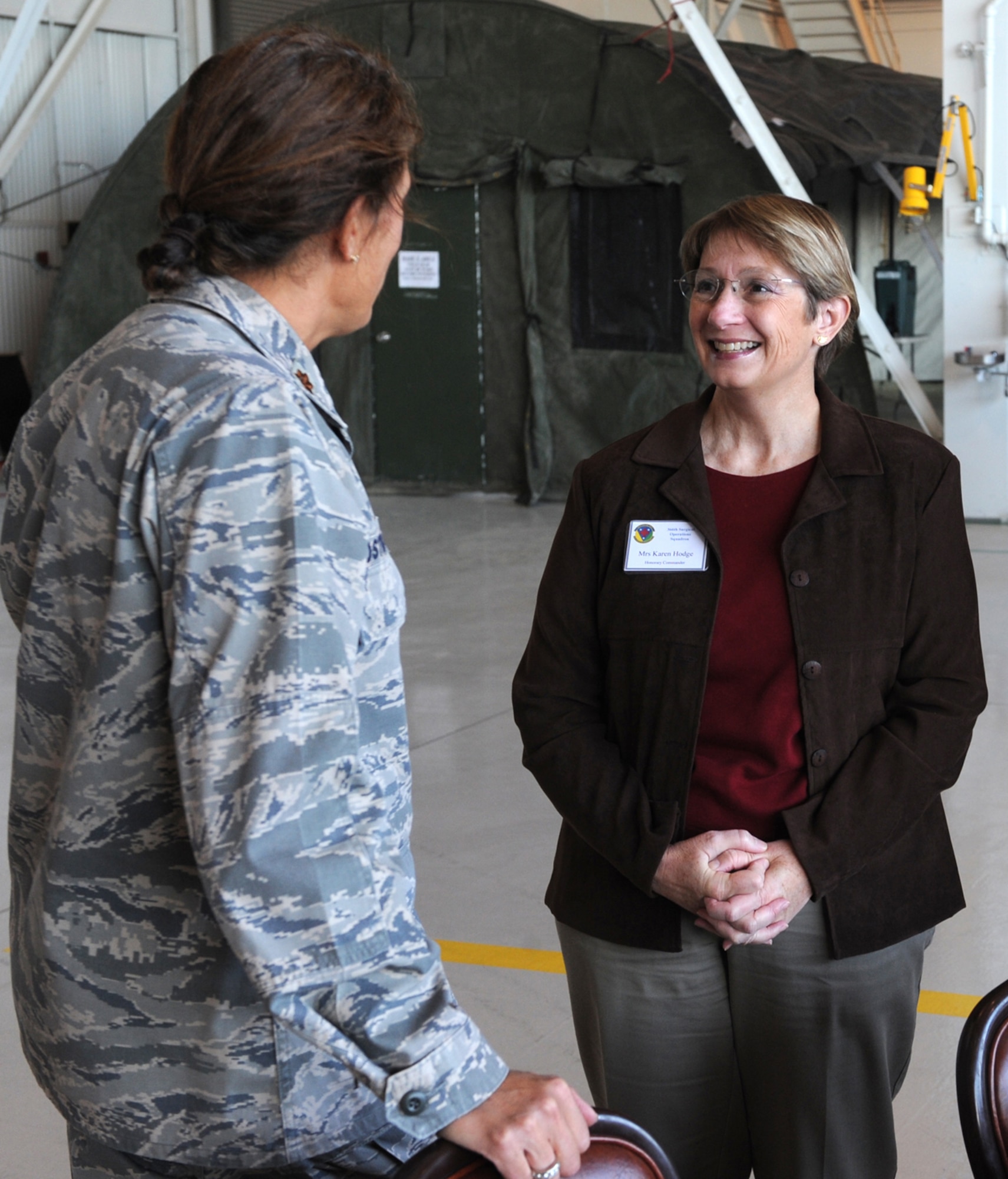 MOUNTAIN HOME AIR FORCE BASE, Idaho -- Karen Hodge, 366th Medical Surgical Group Squadron honorary commander, talks to Maj. Julie Ostrand, OB/GYN Services Flight Commander, during the Honorary Commander Change of Command Ceremony Oct. 22 in hangar 1331. The Honorary Commander program is designed to increase the understanding of the 366th Fighter Wing and Air Force missions by pairing community leaders with the wing’s leaders to forge new relationships. (U.S. Air Force photo by Senior Airman Debbie Lockhart)
