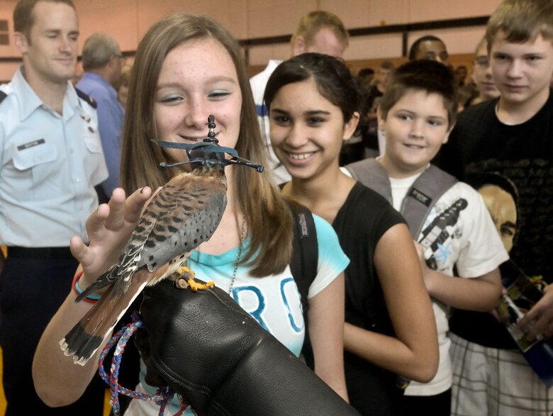 Students were able to individually meet Cadet 3rd Class Danielle Cortez and  "Buzz," a kestrel falcon who had the attention of the students and faculty of Lyndon B. Johnson Middle School Oct. 28, 2010, in Melbourne, Fla. (U.S. Air Force photo/Lance Cheung)