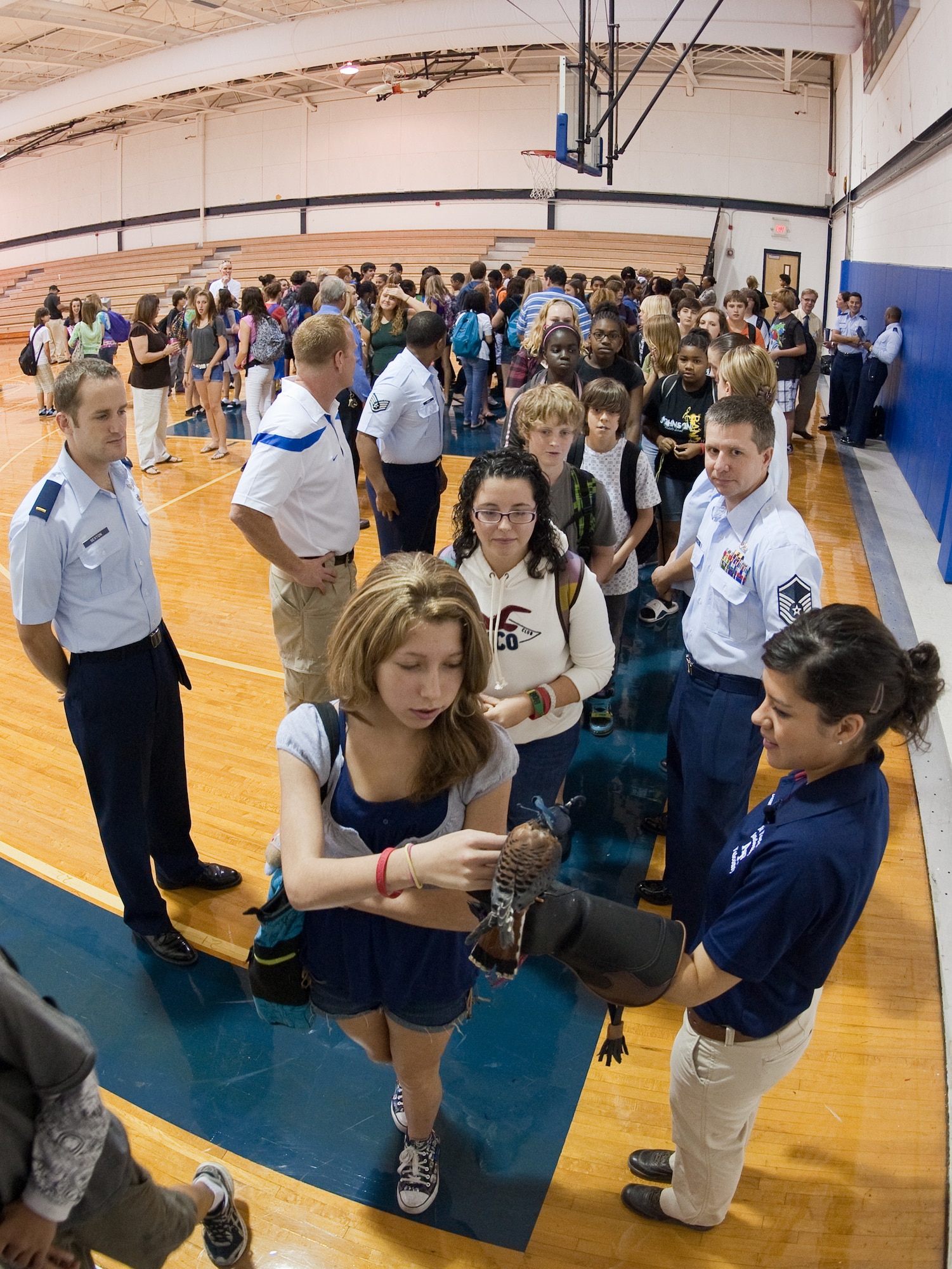 Students were able to individually meet Cadet 3rd Class Danielle Cortez and "Buzz," a kestrel falcon who had the attention of the students and faculty of Lyndon B. Johnson Middle School Oct. 28, 2010, in Melbourne, Fla. "Buzz" is named after the "Toy Story" character Buzz Lightyear. Cadet Cortez and "Buzz," from the U.S. Air Force Academy, Colo., and personnel from nearby Patrick Air Force Base, Fla., educated and informed the audience about the art and history of falconry, and the educational and career opportunities at the U.S. Air Force Academy and in the U.S. Air Force. (U.S. Air Force photo/Lance Cheung)