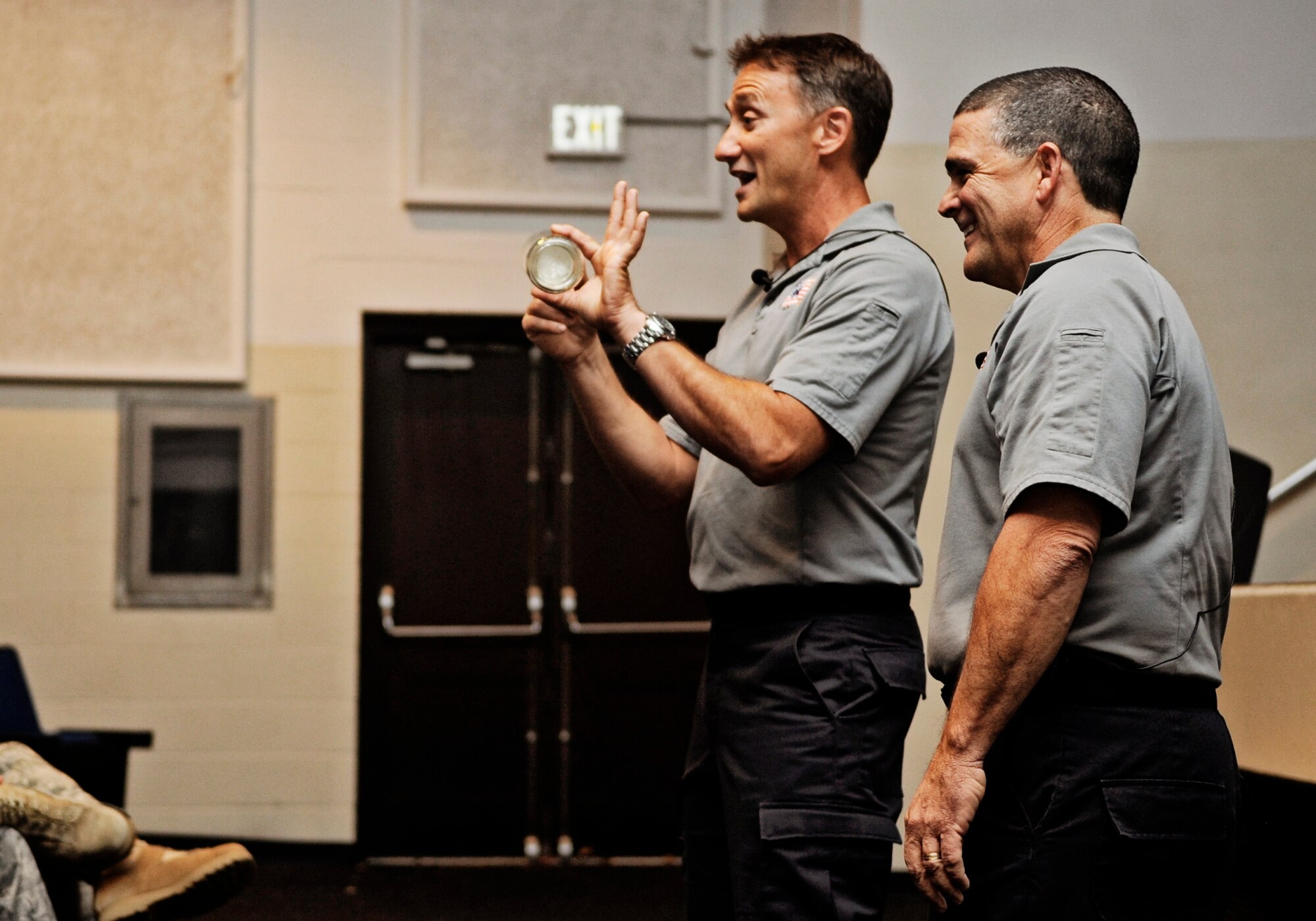 SCOTT AIR FORCE BASE, Ill. -- Vince Easevoli, Stay Alive from Education (S.A.F.E.) executive director, and Ronny Garcia, S.A.F.E. briefer, demonstrate to the audience what happens to your body in a car crash using an egg  and a glass jar during a Street Smart presentation Oct. 27. “Street Smart” is a program developed by S.A.F.E. 21 years ago to eliminate trauma related death. (U.S. Air Force photo/ Staff Sgt. Ryan Crane)
