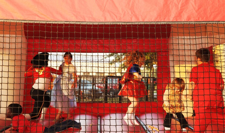 BARKSDALE AIR FORCE BASE, La. -- Children play in a bounce house during the third annual Trunk-or-Treat event held at Chapel 2. The activity was held to give kids of the Barksdale community an alternative way to celebrate Halloween. (U.S. Air Force photo/Airman 1st Class Sean Martin)