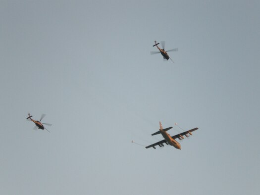 PATRICK AIR FORCE BASE, Fla. - Rescue Reservists from the 920th Rescue Wing simulate a mid-air refueling operation during a demonstration for Air Force Week at the Cocoa Beach Pier. This event showcases the crews of the HH-60G Pave Hawk helicopter and HC-130P/N King who are Air Force Reserve combat-search and rescue experts. These aircraft also serve as a platform for the pararescuemen when they perform their life-saving skills during a water rescue. The PJs are also expert SCUBA divers, mountaineers, marksman and parachutists. (U.S. Air Force photo/Staff Sgt. Leslie Kraushaar) 

