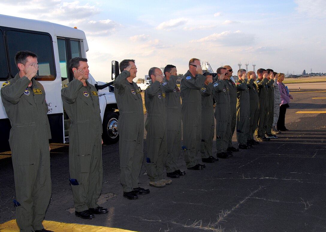 Members of the 80th FlyingTraining Wing, including commander Col. Kevin Schneider (far left), render proper customs and courtesies Oct. 21 as the aircraft carrying NATO Air Chiefs prepares to depart. The Air Chiefs made a quick stop at Sheppard to receive a mission brief and tour the flightline and flight simulator facility used to train student pilots at the Euro-NATO Joint Jet Pilot Training Program. (U.S. Air Force photo/Harry Tonemah)