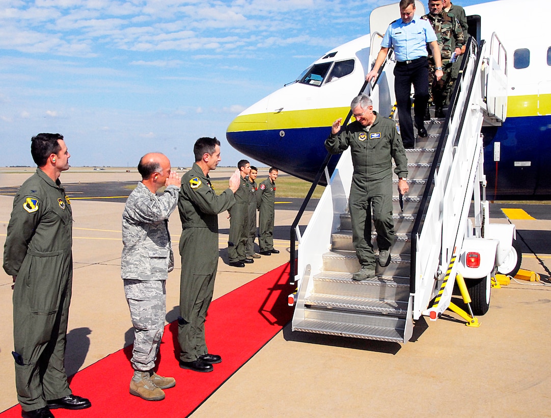 Gen. Roger Brady (on steps), commander of U.S. Air Forces Europe, departs an aircraft Oct. 21 at the 80th Flying Training Wing flightline. General Brady and Air Chiefs from NATO partners stopped at Sheppard Air Force Base, Texas, as part of a tour of several locations in the United States. (U.S. Air Force photo/Harry Tonemah)