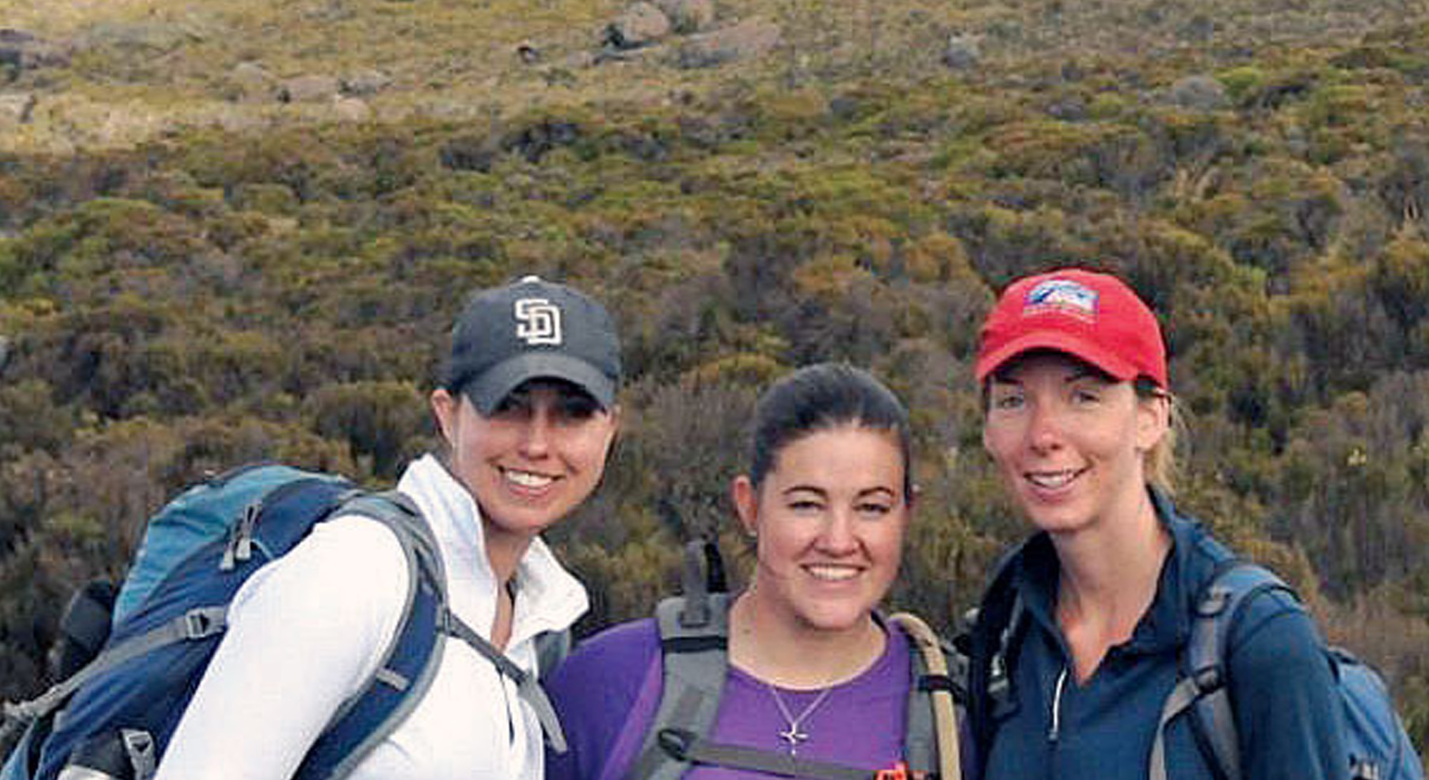 Maj. Lisa Reaver (center) poses with fellow climbers Lauren Drietzler (left) and Heather Ruhle after summiting Mount Kilimanjaro's Uhuru Peak. (Courtesy photo)