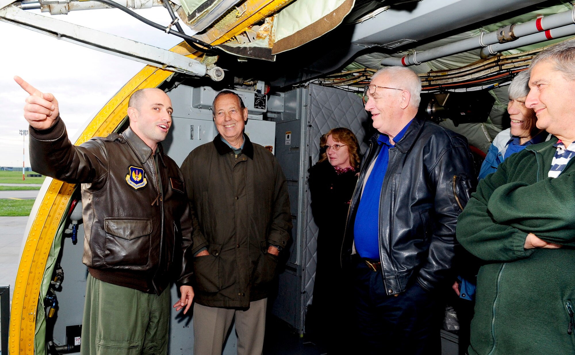 RAF MILDENHALL, England -- Capt. Jonathan Reed, 100th Air Refueling Wing chief of flight safety, talks to members of the Anglia Gliding Club about the mission of the KC-135 during a tour Oct. 22. The tour was held for the gliding club to help build community relations and to reinforce flight safety measures. (U.S. Air Force photo/ Senior Airman Ethan Morgan)