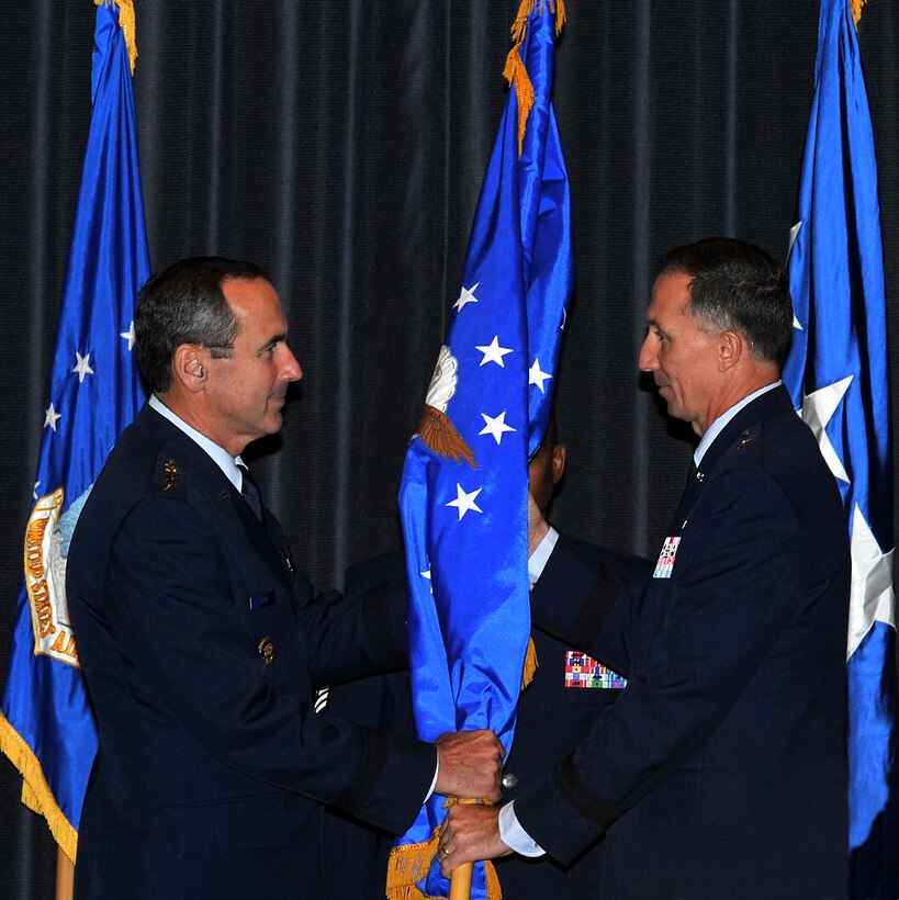 General Raymond E. Johns, left, Air Mobility Command commander, transfers command of the U.S. Air Force Expeditionary Center to Brig. Gen. William Bender (right) Oct. 26 at Joint Base McGuire-Dix-Lakehurst, N.J. General Bender follows outgoing commander Brig. Gen. Richard Devereaux, who was assigned to the Pentagon, Washington, D.C. (U.S. Air Force photo by Jack Neith/Released)