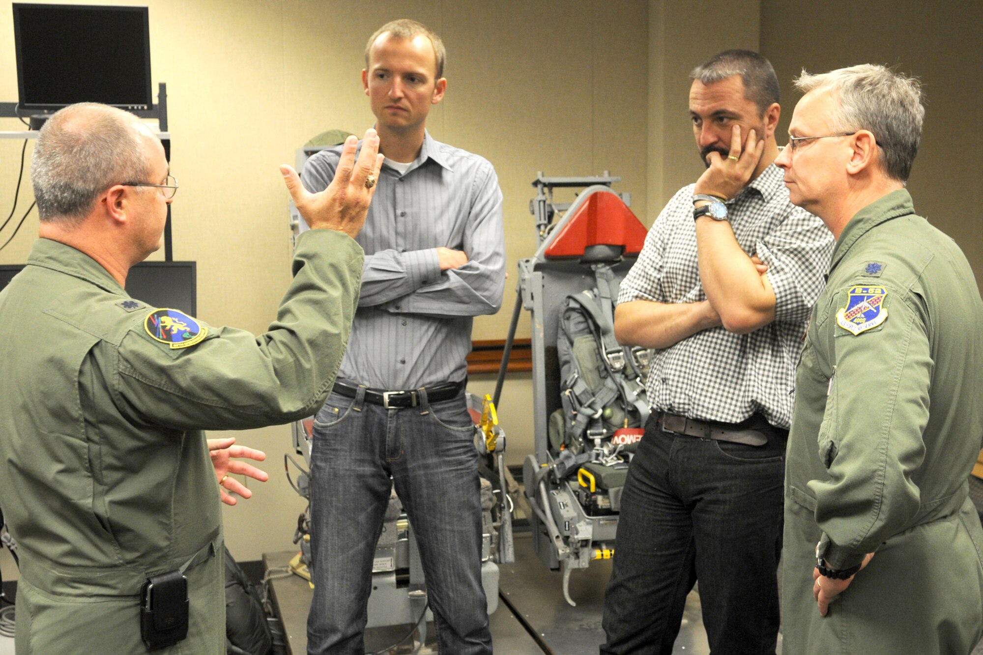 Dr. Petr Zlatohlavek, North Atlantic Treaty Organization Information Center executive chairman, Zbynek Pavlacik, Jagello 2000 Association chairman Spectators, and Lt. Col. Joseph Jones, 93rd Bomb Squadron commander, look on as Lt. Col. Dave Webb, 917th Operations Support Flight commander, describes the aircrew seat ejection system of a B-52H Stratofortress, on Oct. 26, 2010, 917th Wing, Barksdale Air Force Base, La. The Jagello 2000 Association is a top Czech Republic nonprofit, nongovernmental organization in the field of public and defense diplomacies, focusing on the presentation of NATO and security politics for the general public. It is also the main sponsor of the NATO Days in Ostrava air show, which was held Sept. 18-19, 2010, in Ostrava, Czech Republic. The 917th Wing supplied a B-52H Stratofortress and personnel in support of the air show, which marked the first-time a B-52 visited the Czech Republic. (U.S. Air Force photo/Master Sgt. Greg Steele)
