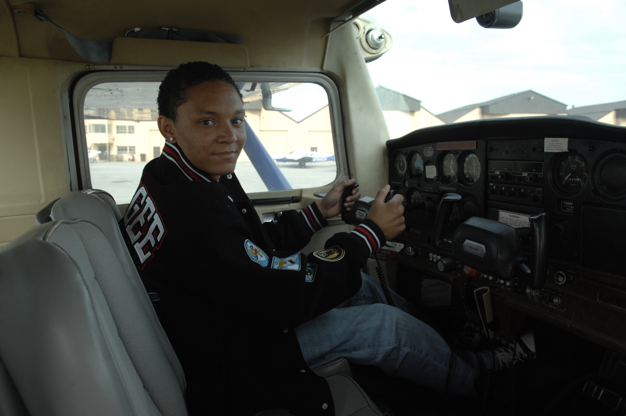 SCOTT AIR FORCE BASE, Ill. -- Tyrell Rhodes, 16, sits in the cockpit of the Cessna 152 he flies during his pilot's courses. Tyrell was born with Cerebral Palsy, but hasn't let that stop him from achieving his goal of becoming a certified pilot. (U.S. Air Force photo/Senior Airman Amber R. Kelly-Herard)